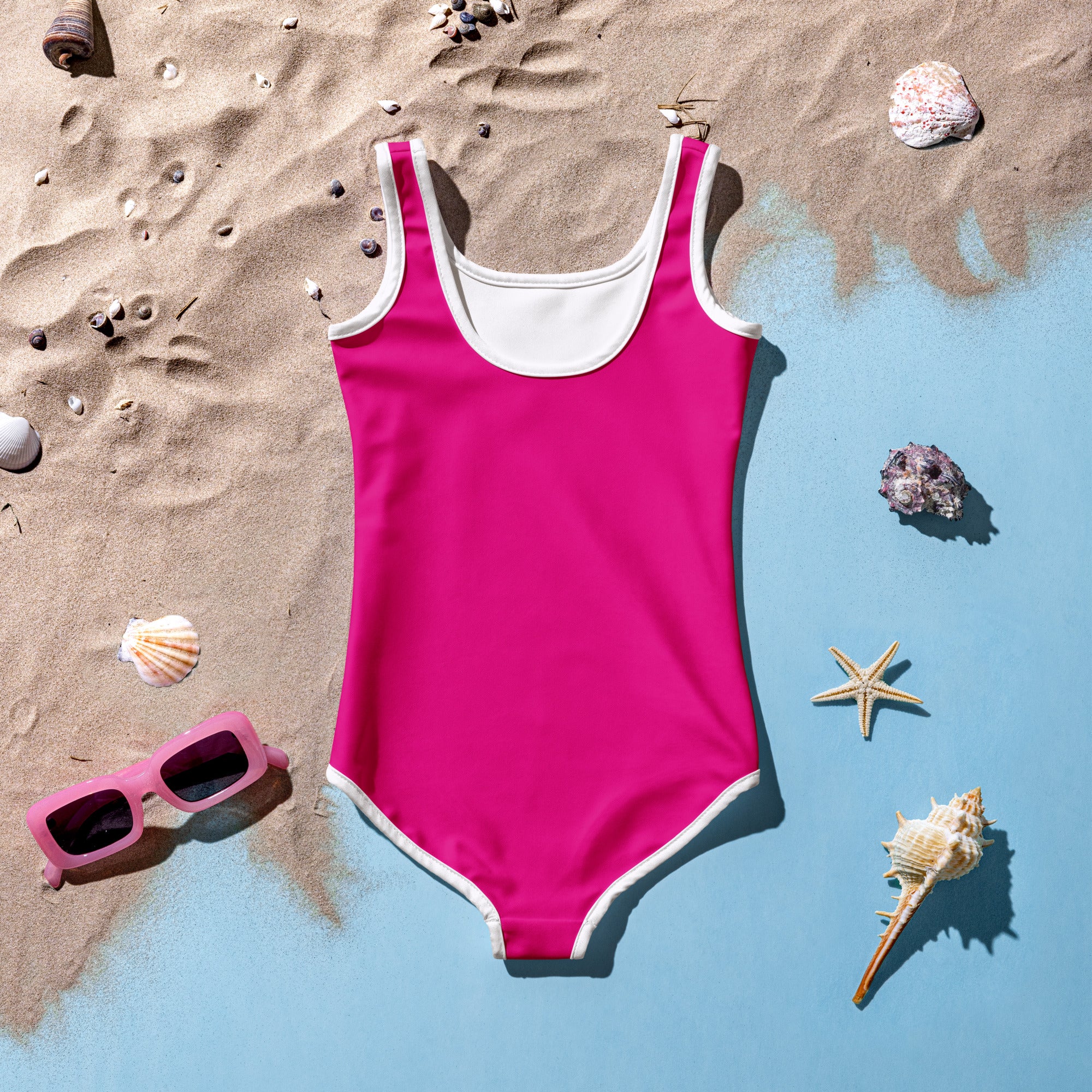 A vibrant fuchsia girls violet red buttery soft one-piece swimsuit with white trim and UPF 50 plus sun protection