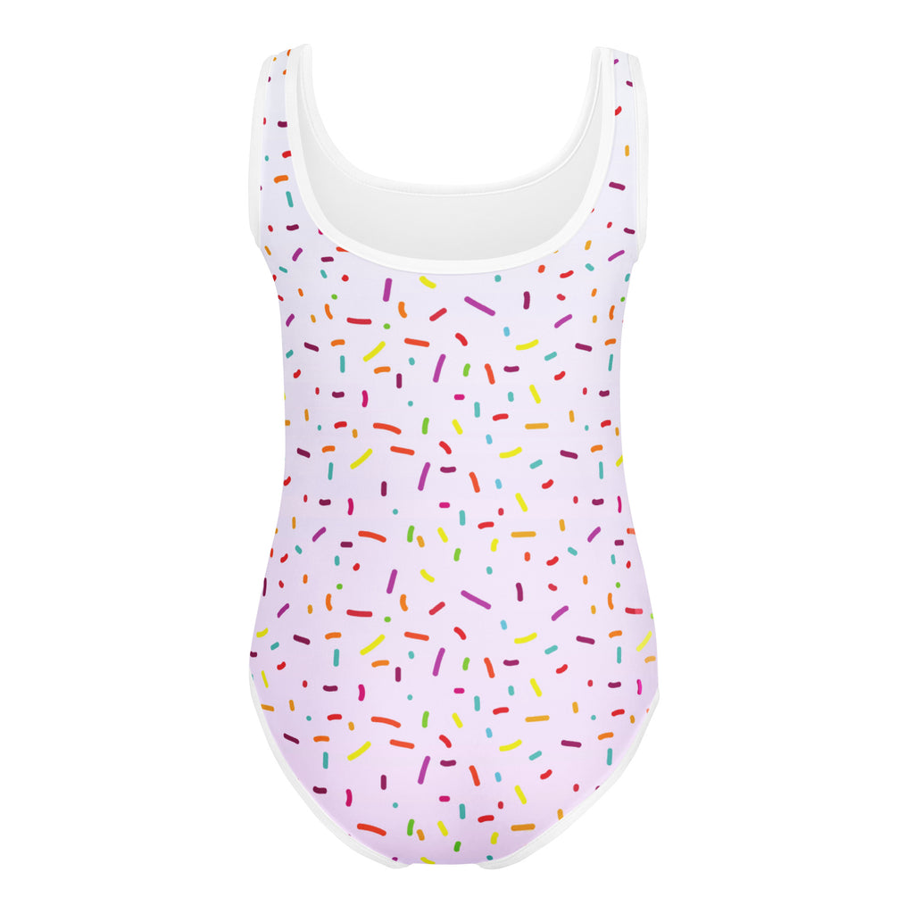 A white one-piece buttery soft swimsuit with a colorful sprinkle pattern quick drying for dance and gymnastics