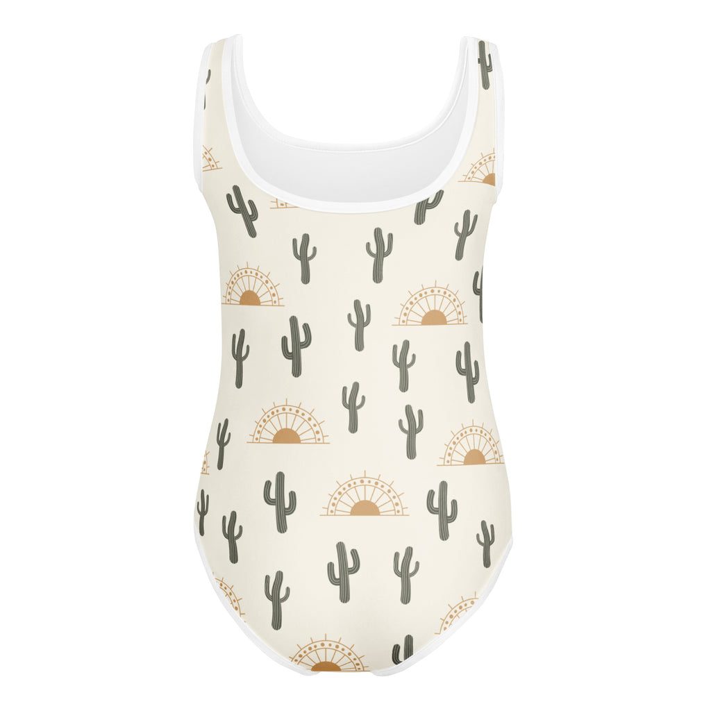 Girls cactus desert sunrise buttery soft cream one-piece swimsuit with white trim and gray cactus sun pattern for dance
