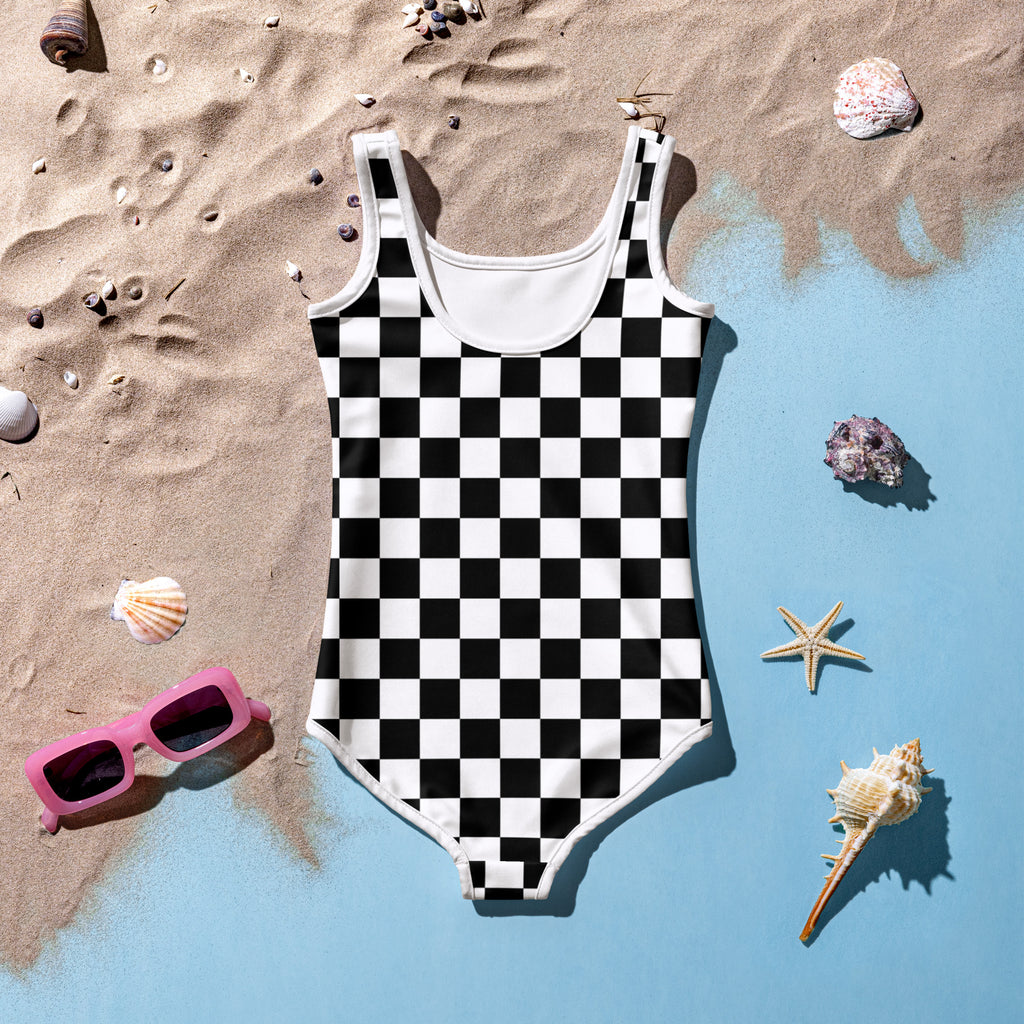 Girls black and white checkered one-piece swimsuit with white trim made of buttery soft fabric and UPF 50+ protection