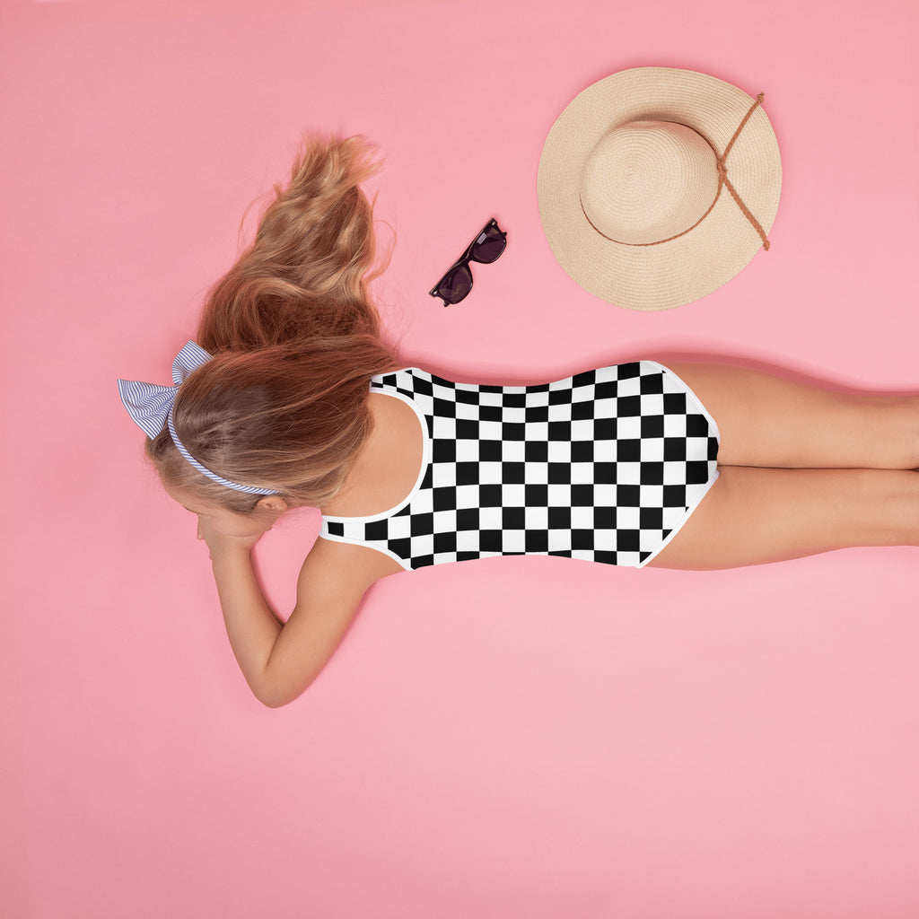 Girls black and white checkerboard one-piece swimsuit with buttery soft fabric racerback and upf 50 plus protection