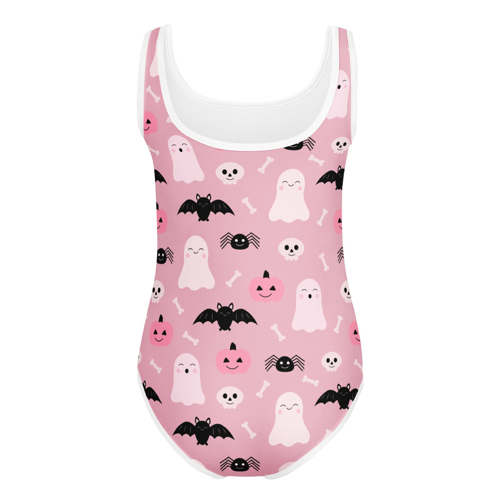 Girls pink halloween one-piece swimsuit with white trim and ghosts bats pumpkins skulls for dance and gymnastics