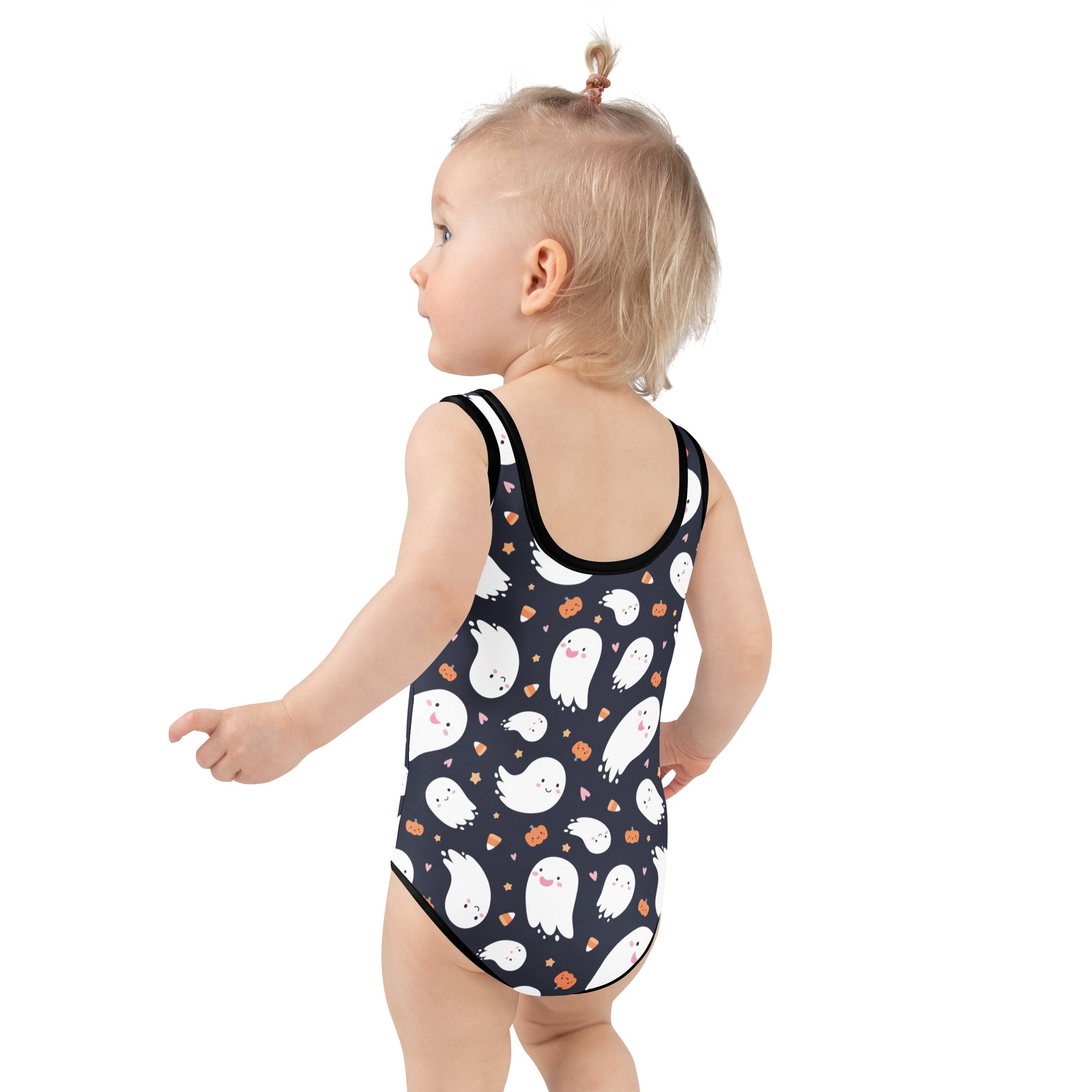Black one-piece girls swimsuit with white cartoon ghosts and orange pumpkin accents for halloween fun