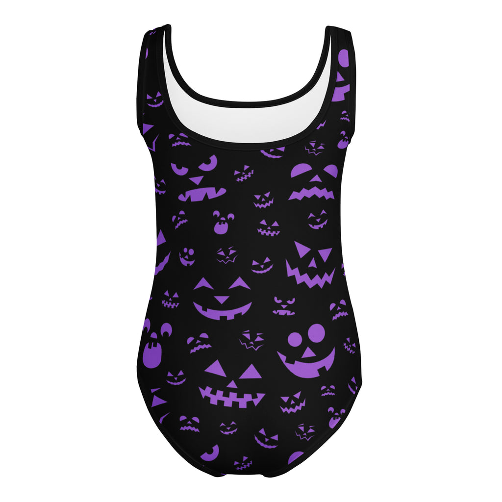 Black one-piece swimsuit with purple jack-o-lantern faces in buttery soft fabric for girls dance and gymnastics