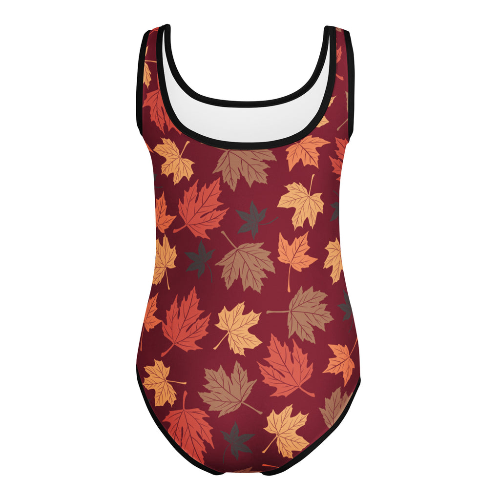 A maroon girls autumn leaves buttery soft leotard with vibrant leaf pattern and black trim for dance and gymnastics