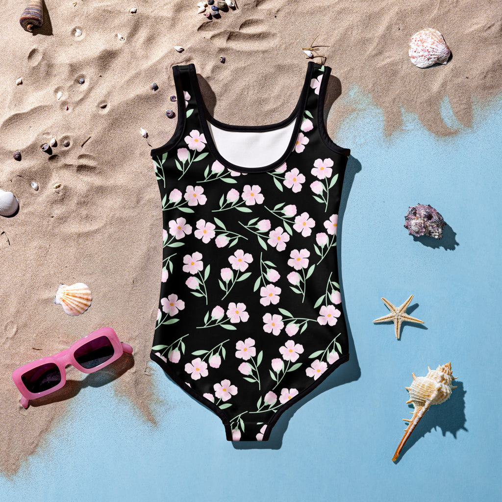 Black one-piece girls swimsuit with pink flower pattern and green stems buttery soft fabric upf 50+ protection