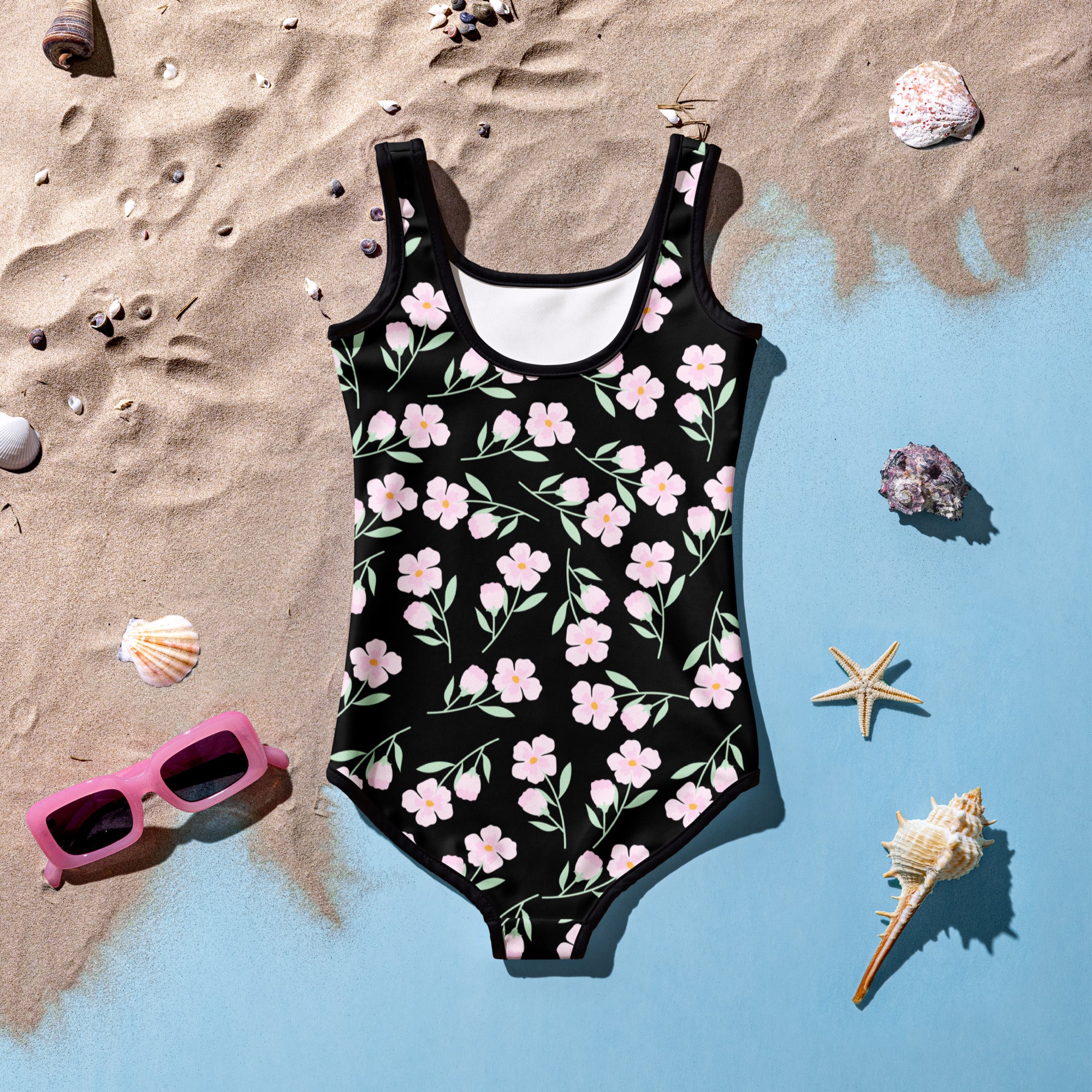 Black one-piece girls swimsuit with pink flower pattern and green stems buttery soft fabric upf 50+ protection