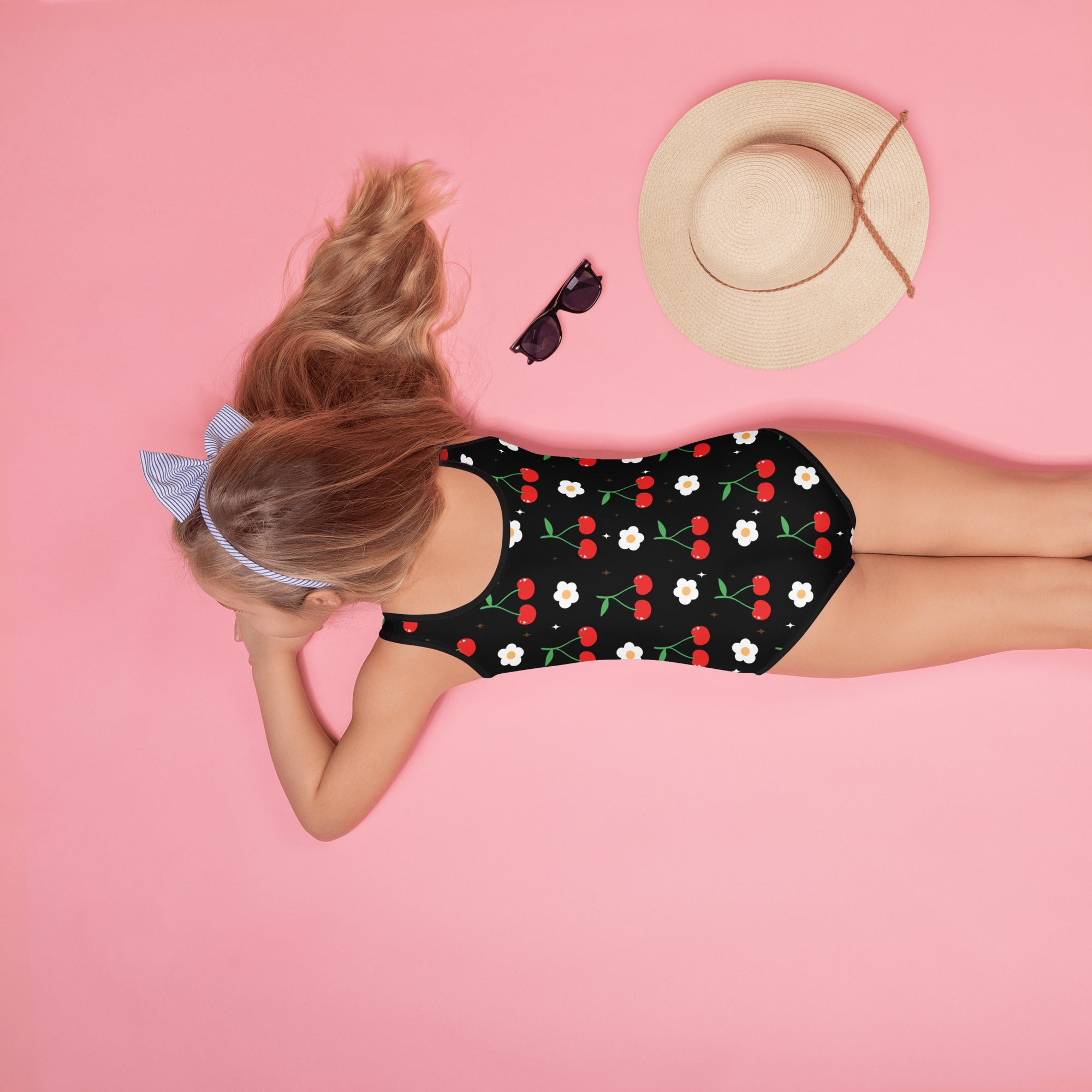 Black girls cherry blossom buttery soft one-piece swimsuit with red cherries white flowers and UPF 50+ protection