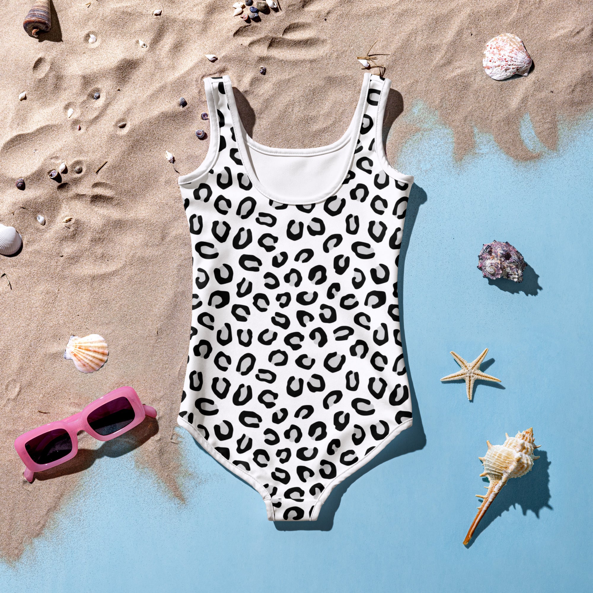 Girls white one-piece swimsuit with black leopard print pattern buttery soft fabric and UPF 50 plus protection