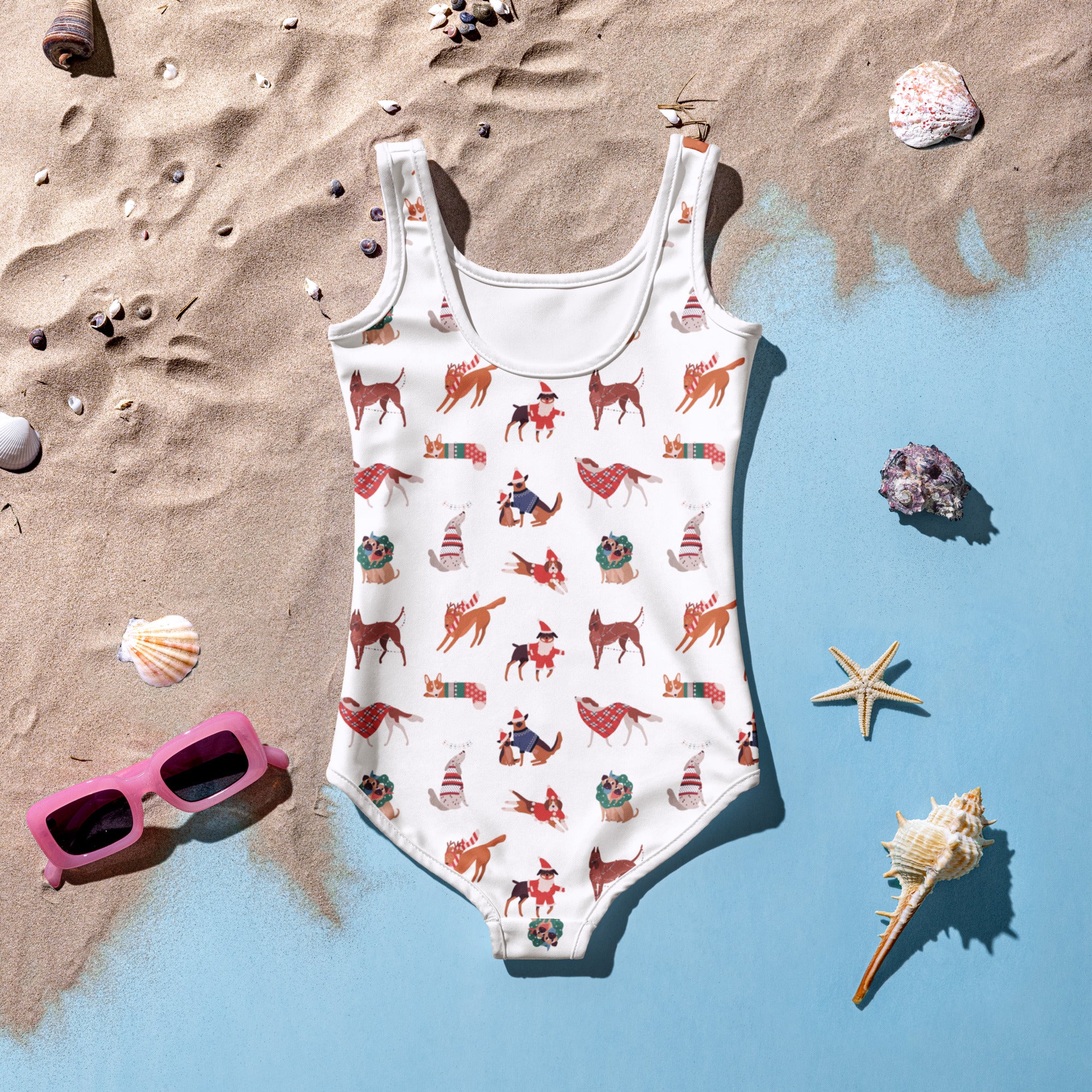 White one-piece girls swimsuit with playful holiday dog pattern featuring upf 50+ buttery soft fabric