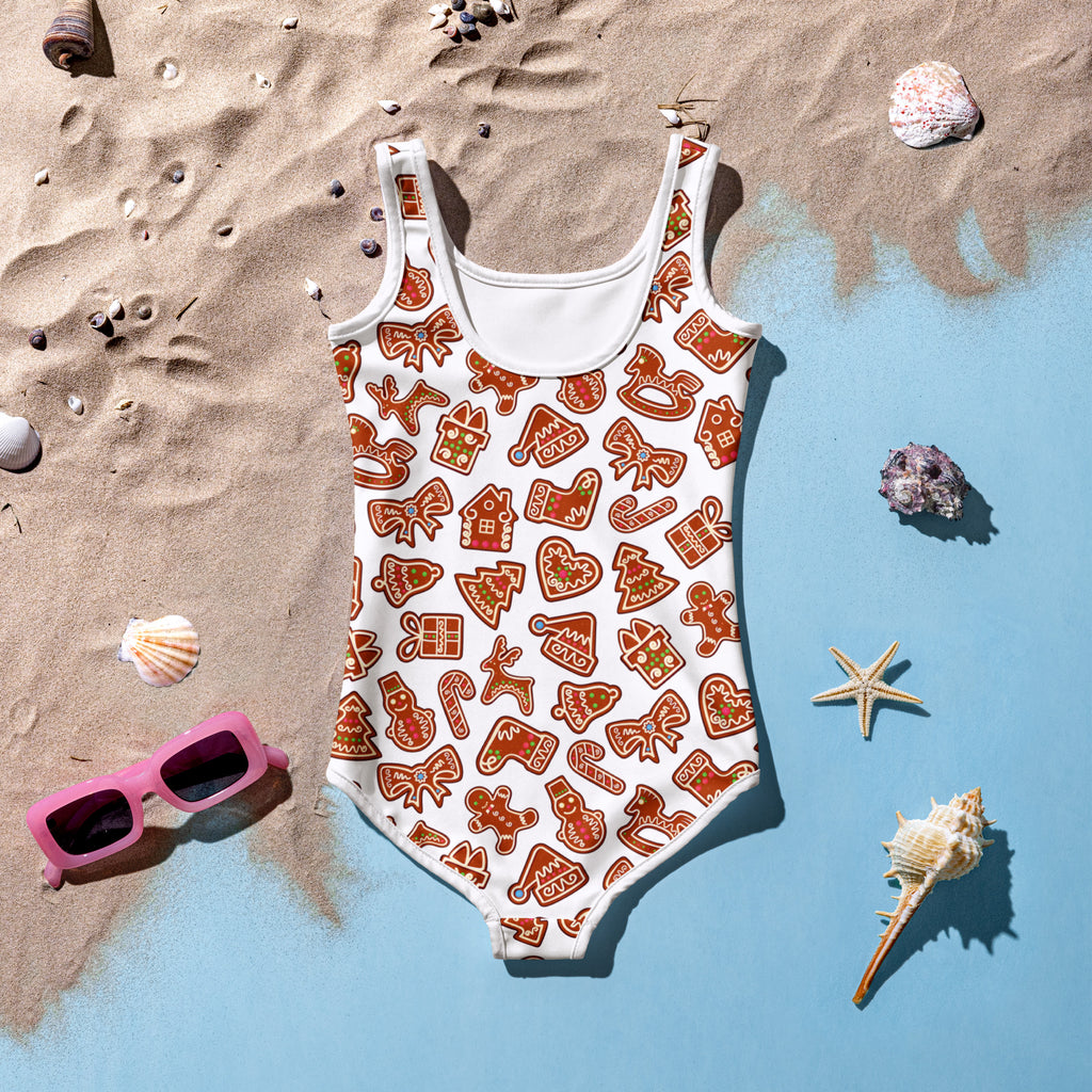 Girls gingerbread buttery soft white one-piece swimsuit with upf 50 plus and orange festive gingerbread pattern