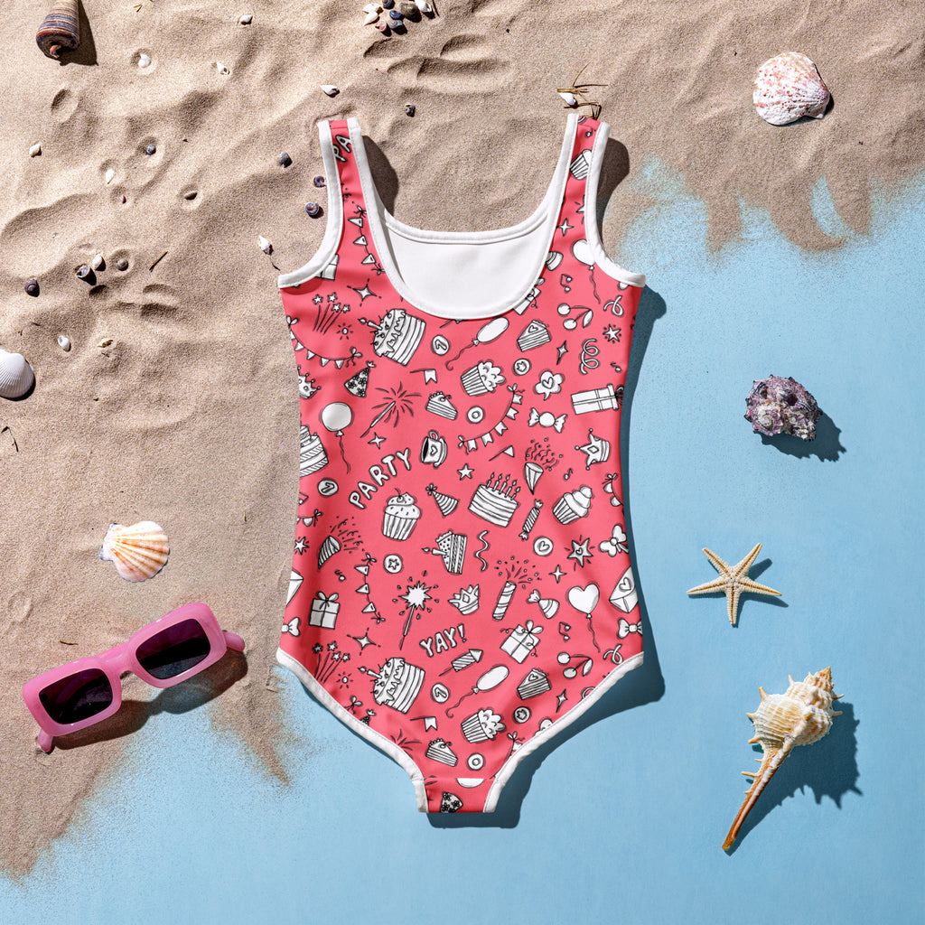 Girls pink birthday party buttery soft swimsuit with UPF 50 plus featuring cupcakes cakes balloons and party pattern