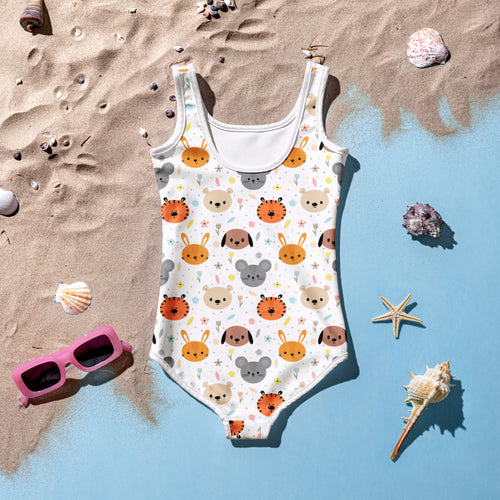 A white girls one-piece swimsuit with buttery soft fabric, cartoon animal faces pattern, and UPF 50+ sun protection
