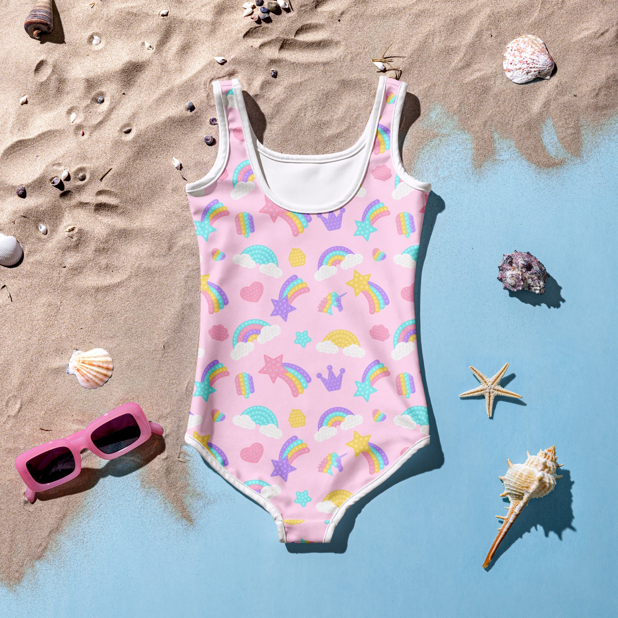 Girls fidget pop themed buttery soft pink one-piece swimsuit with white trim and pastel rainbows stars hearts and crowns