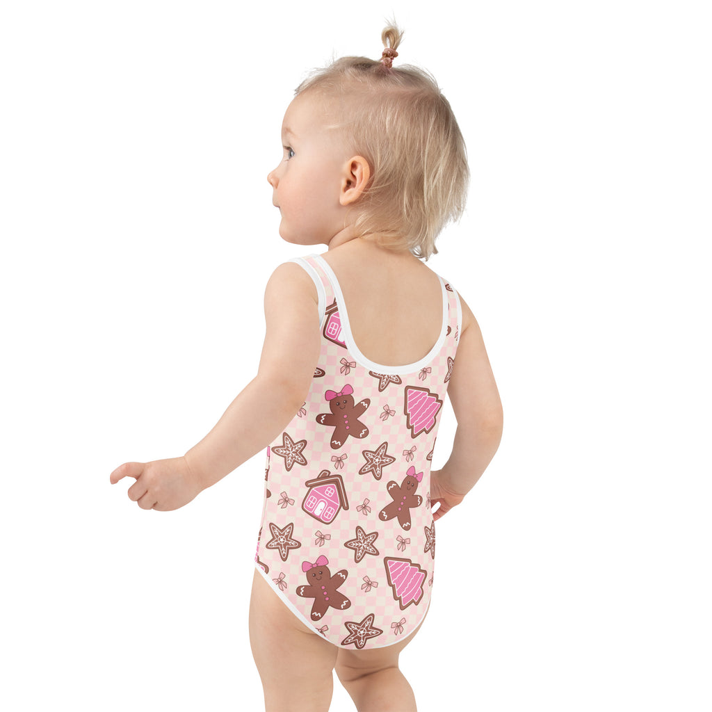 Girls pink one-piece baby bodysuit with gingerbread pattern featuring UPF 50+ buttery soft fabric for sun protection