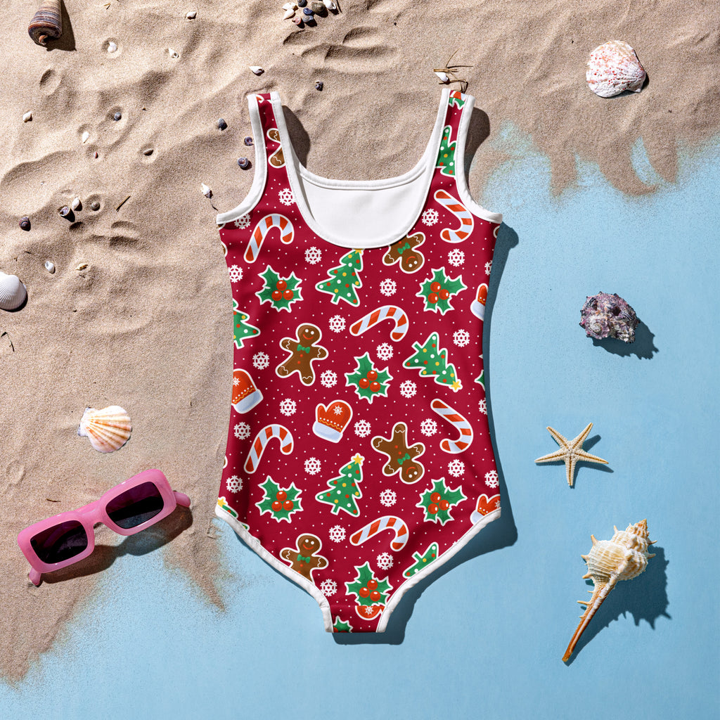 Girls red one-piece Christmas swimsuit with festive cookie print and buttery soft fabric with UPF 50 plus protection