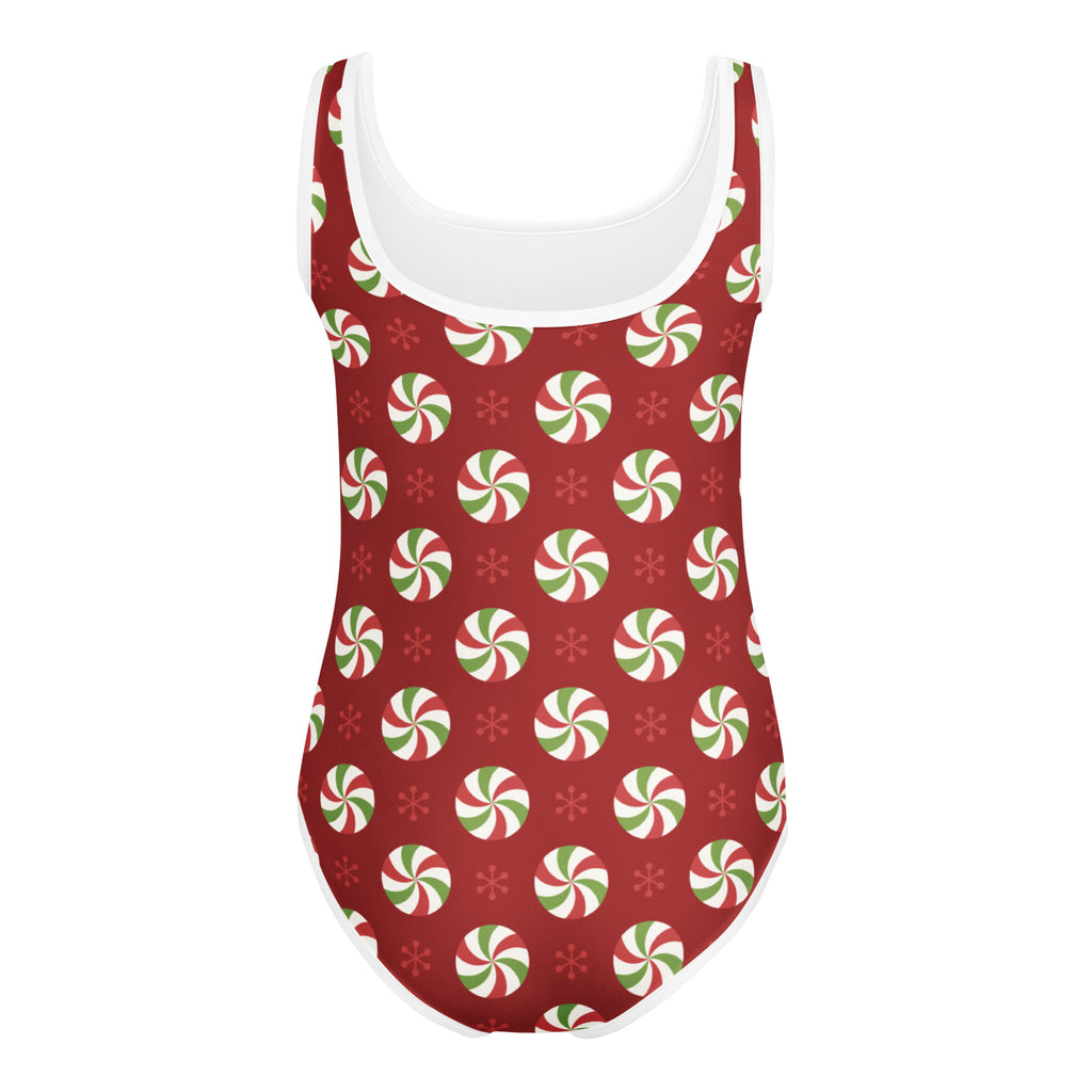 Red one-piece swimsuit with peppermint candy swirls and snowflakes in white scoop neckline for dance and gymnastics