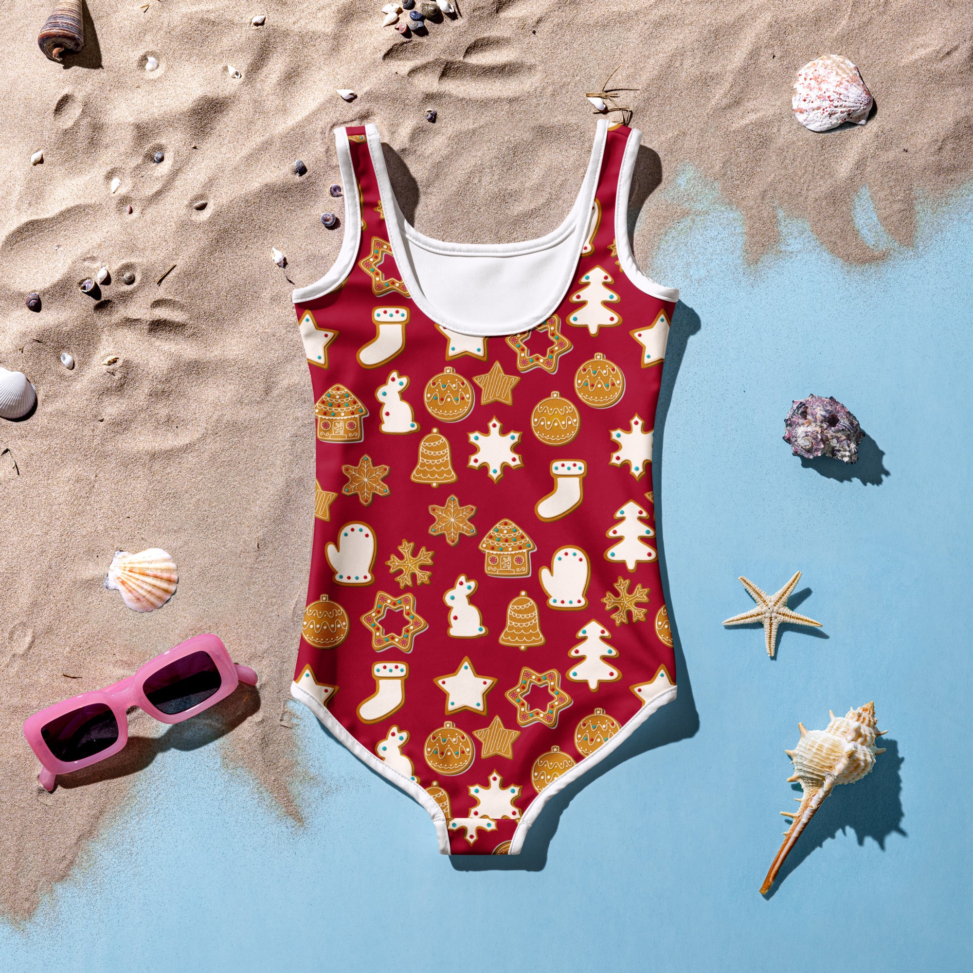 Girls red one-piece swimsuit with white trim and gold cream christmas motifs in buttery soft fabric with UPF 50+ protection