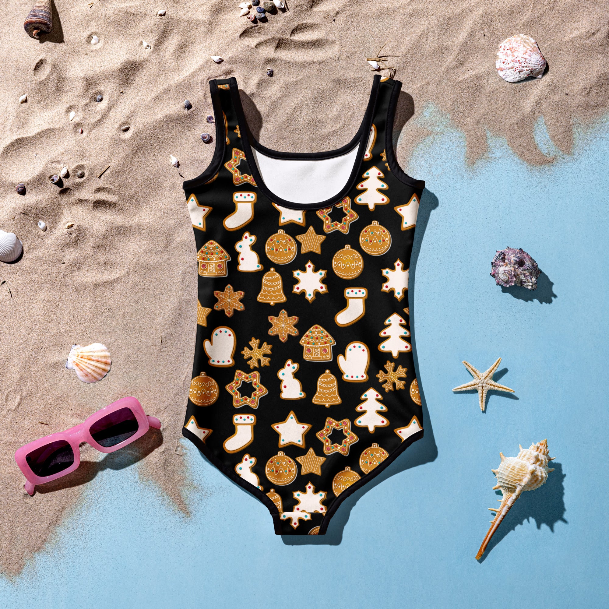 Girls black one-piece swimsuit with golden and white gingerbread cookies festive pattern buttery soft fabric upf 50 plus