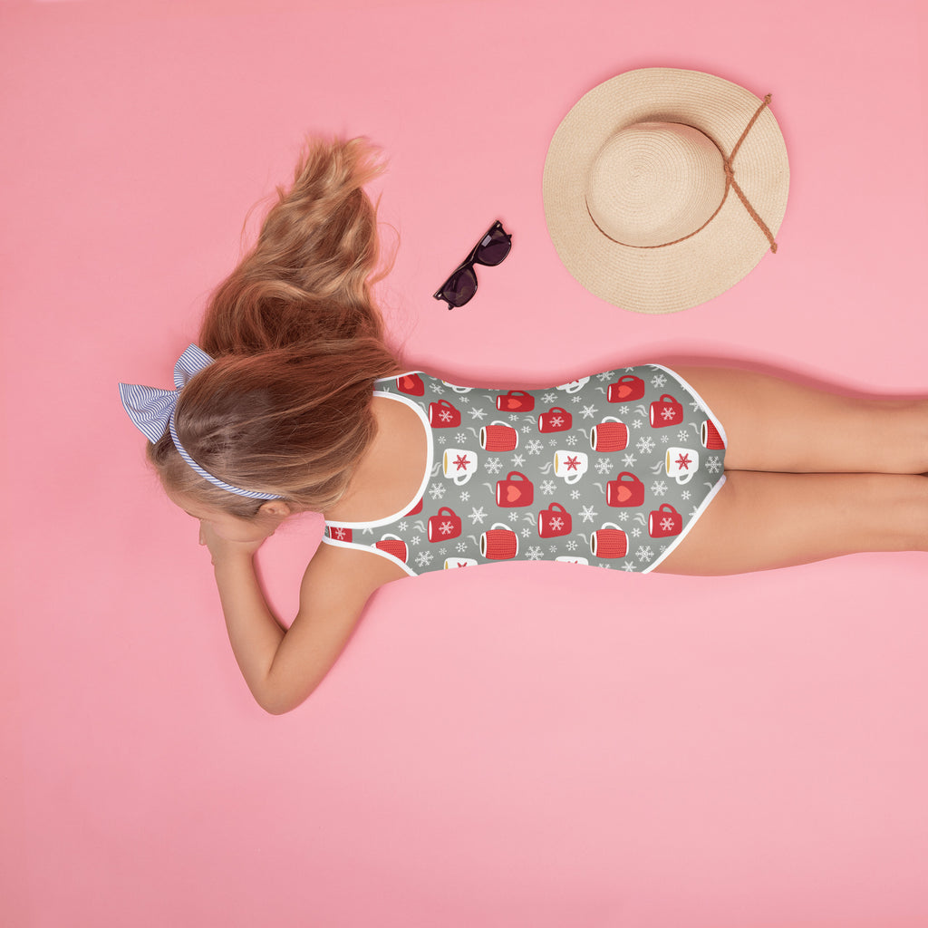 A gray girls one-piece swimsuit with red and white cozy cocoa mug and snowflake pattern and UPF 50+ protection