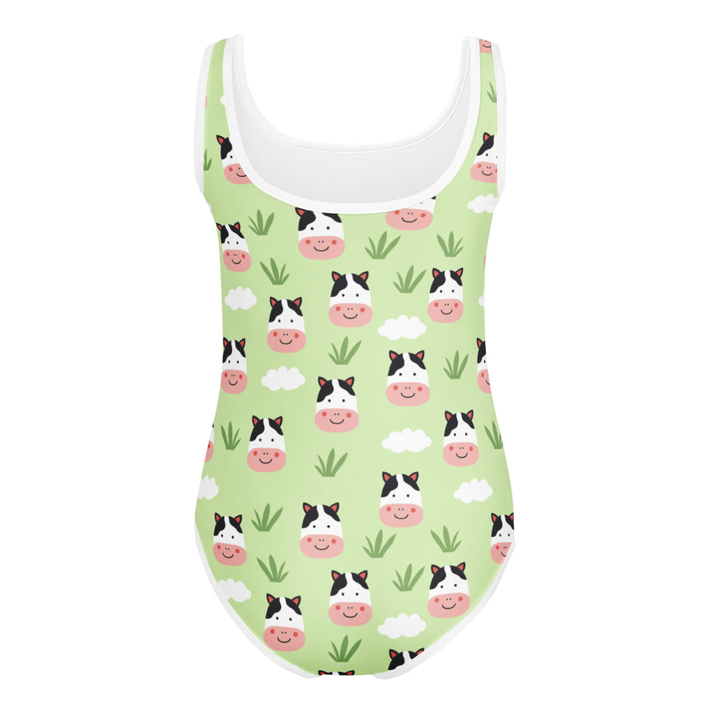 Girls cow print buttery soft light green one-piece swimsuit with playful cartoon cow faces for dance and gymnastics