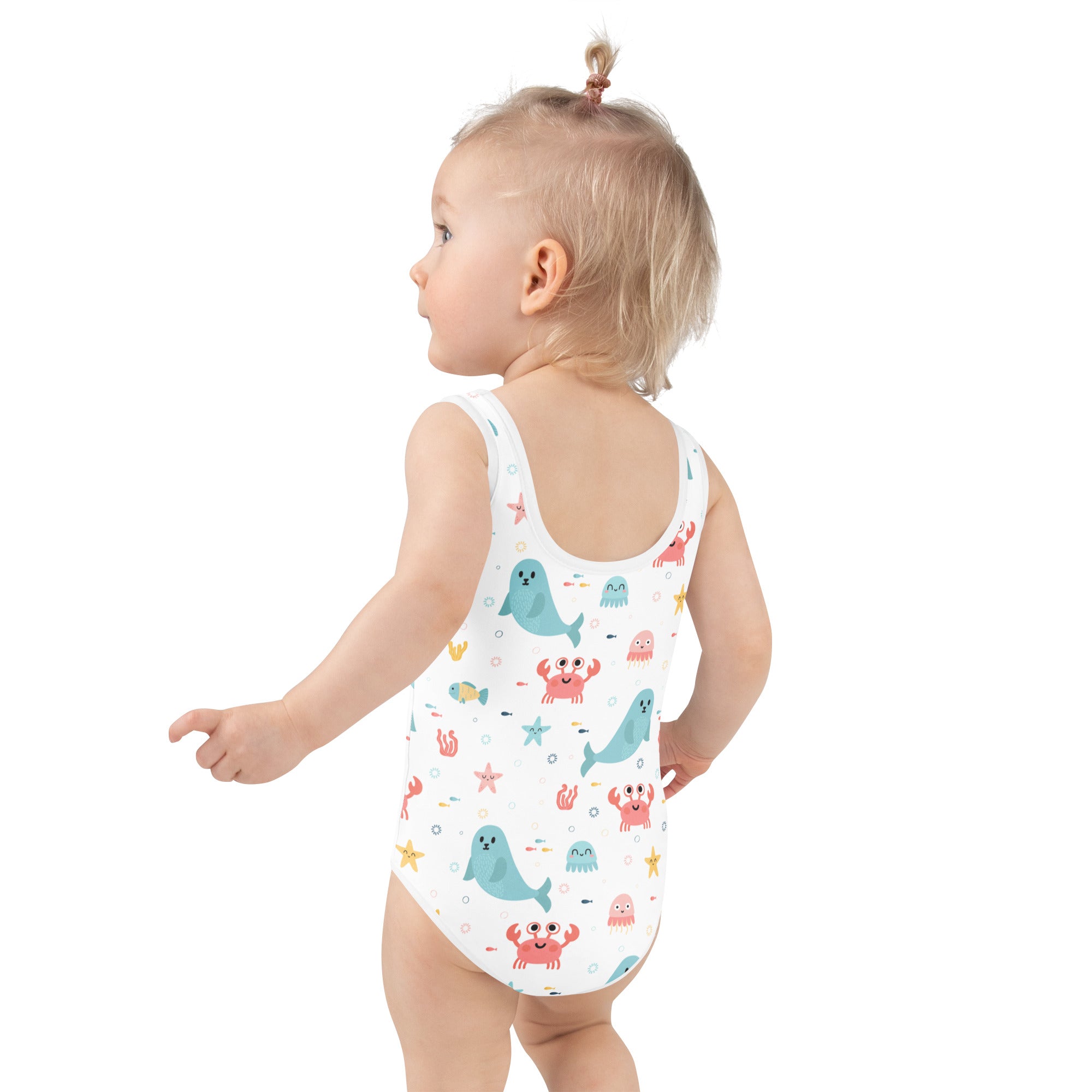 White one-piece girls swimsuit with playful cartoon sea creatures buttery soft fabric and upf 50+ protection