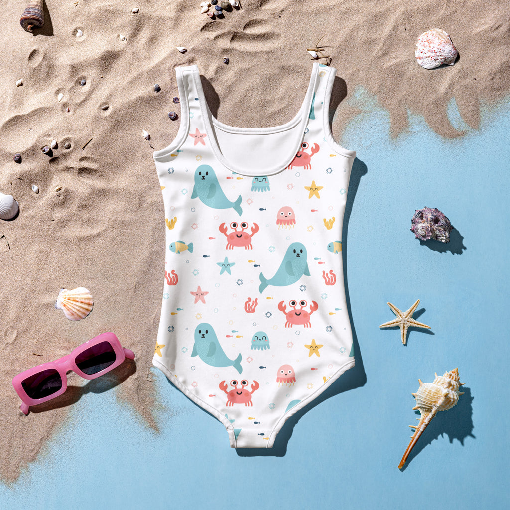 White girls one-piece swimsuit with playful teal whales pink crabs starfish pattern buttery soft fabric upf 50+ protection