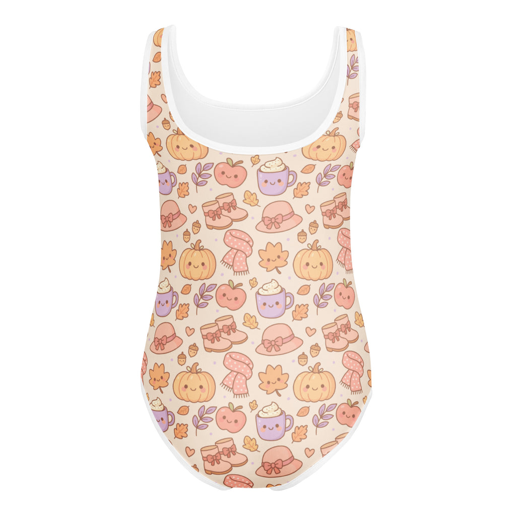 Girls cute fall pumpkin buttery soft beige one-piece swimsuit with white trim and kawaii autumn pattern for dance and gymnastics