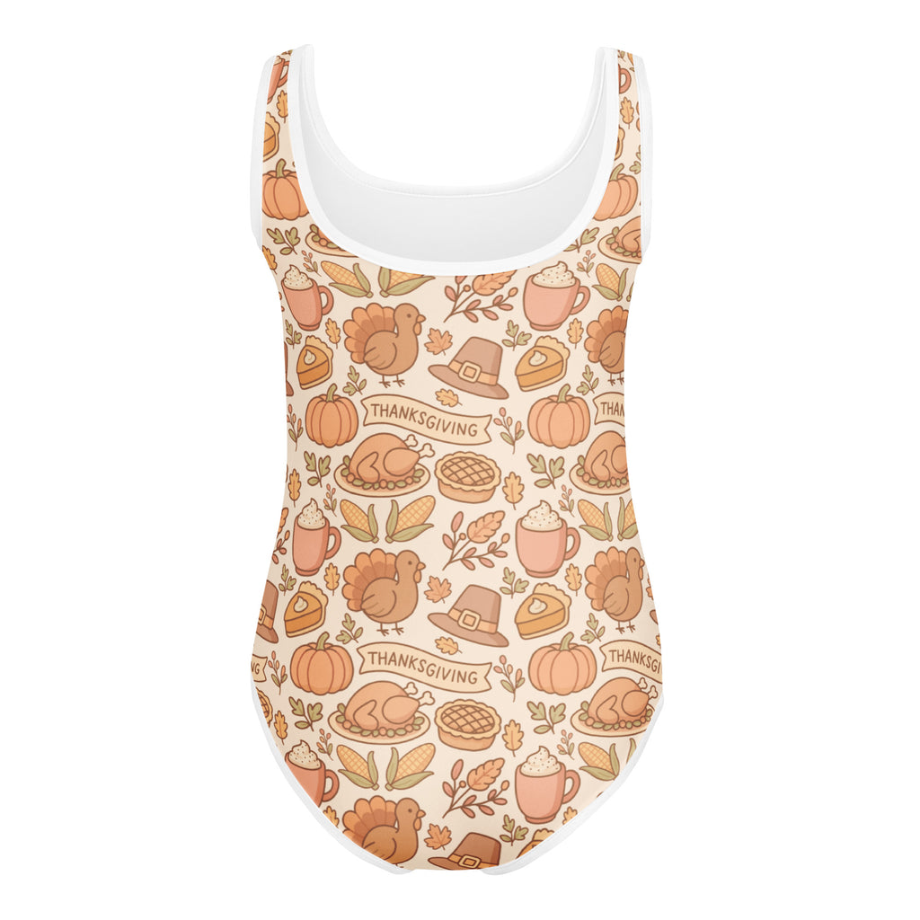 Girls thanksgiving buttery soft beige one-piece swimsuit with white trim and festive pumpkin turkey pie prints for dance and gymnastics