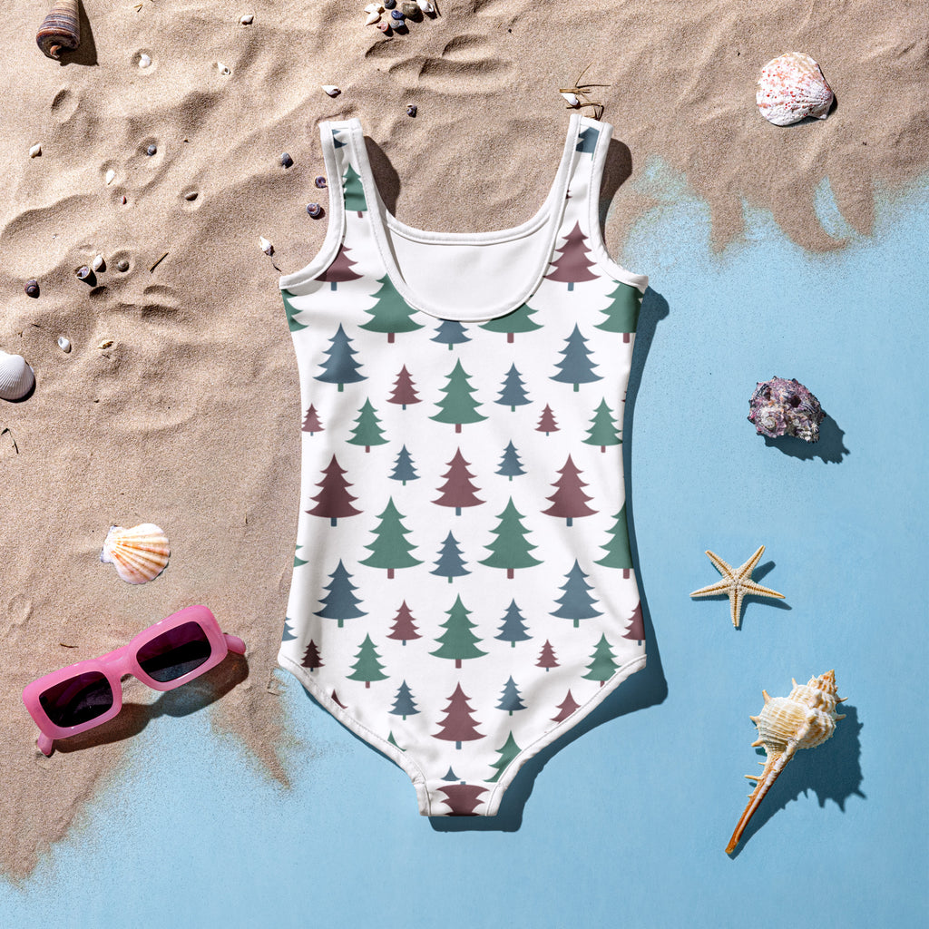 Girls Christmas tree buttery soft white one-piece swimsuit with green and maroon evergreen tree pattern and UPF 50+ protection
