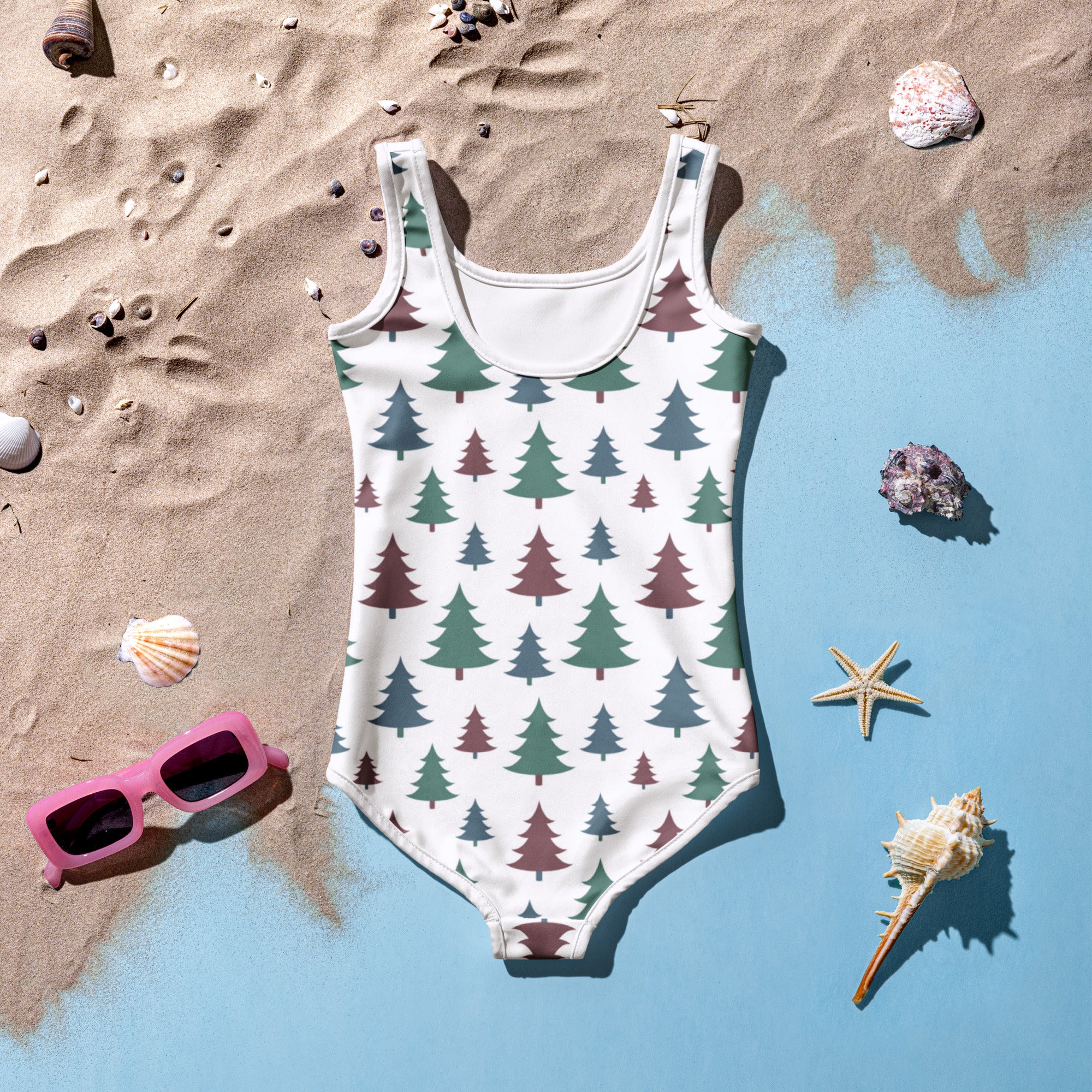 Girls Christmas tree buttery soft white one-piece swimsuit with green and maroon evergreen tree pattern and UPF 50+ protection