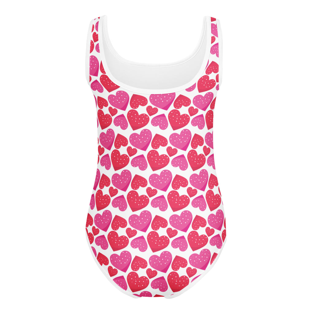 A white girls valentine’s day heart buttery soft leotard with glittery pink and red hearts for dance and gymnastics