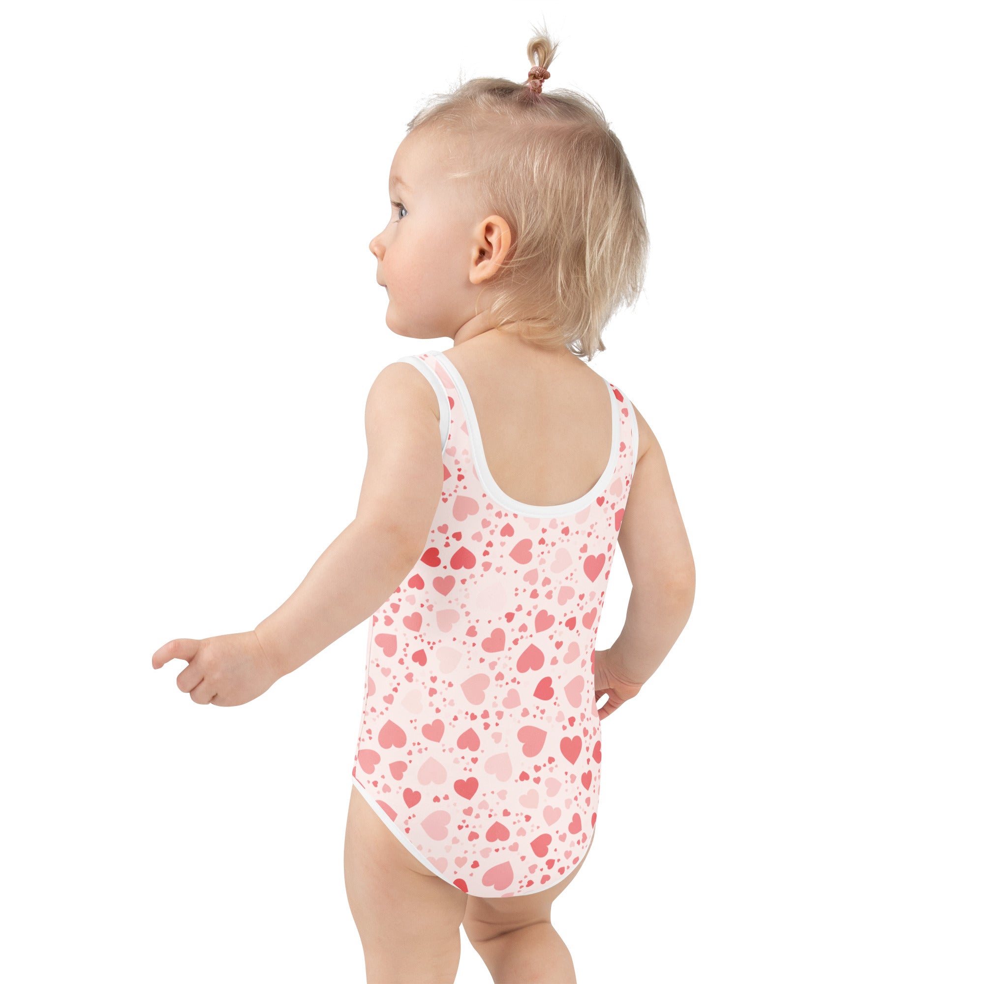 Pink and white heart patterned girls valentines day one piece swimsuit with buttery soft fabric and UPF 50 plus protection