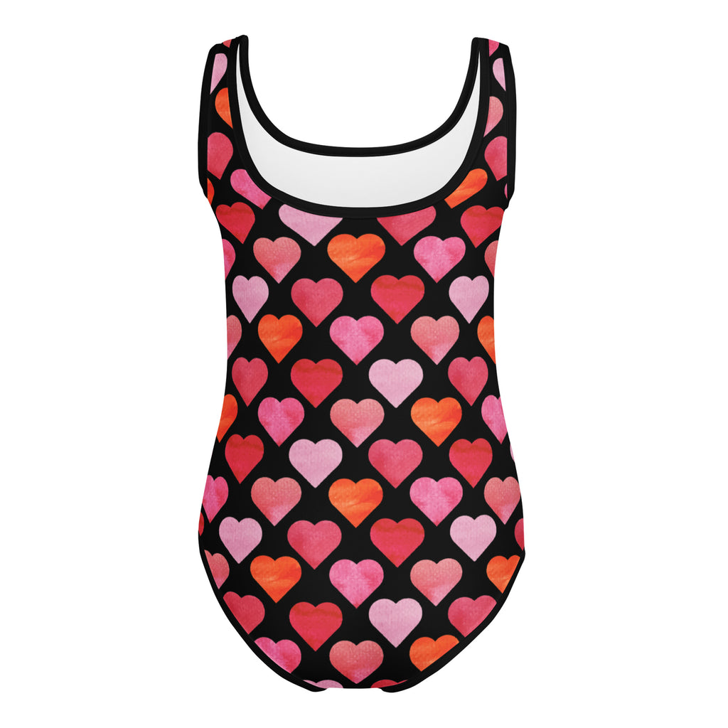 Girls Valentine’s Day black one-piece swimsuit with vibrant watercolor heart pattern in pink coral and orange for dance and gymnastics