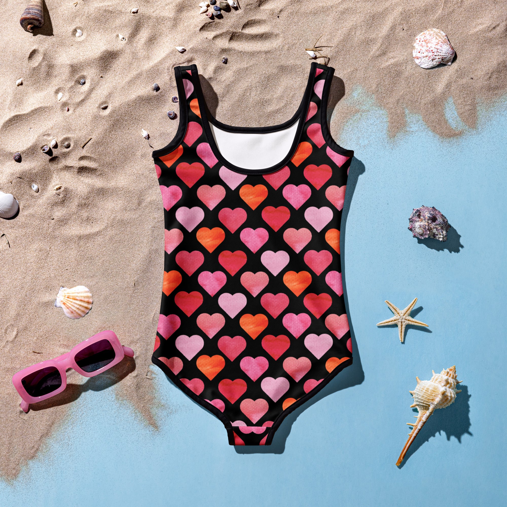 Black girls one-piece swimsuit with vibrant watercolor hearts in pink coral and orange buttery soft upf 50 plus double layered front