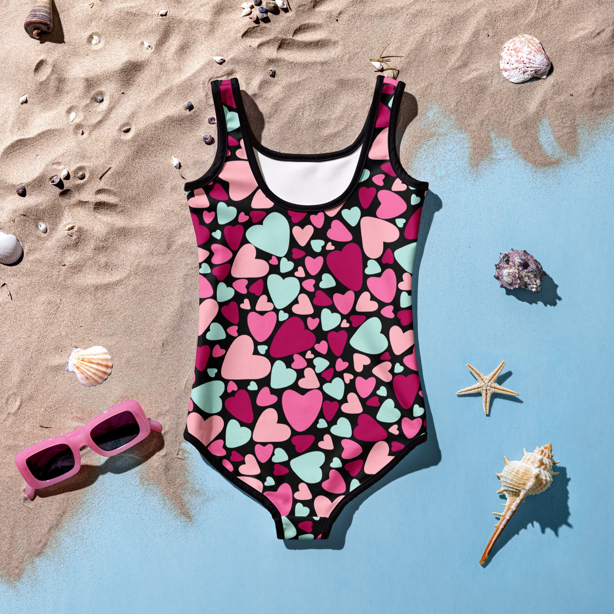 Girls valentine’s day colorful heart buttery soft swimsuit with pink magenta mint hearts on black and white lining upf 50+