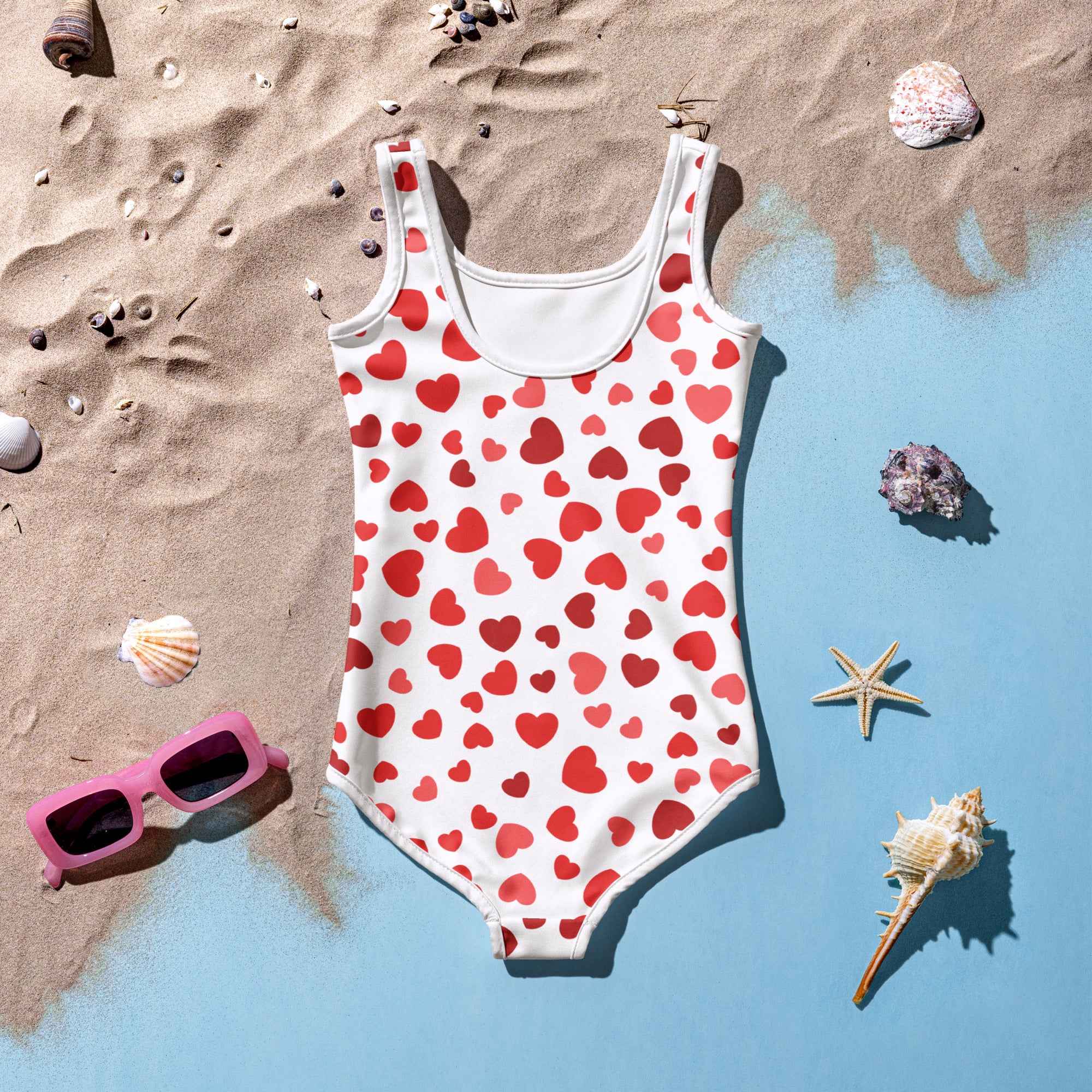 Girls red hearts buttery soft white one-piece swimsuit with playful red hearts pattern and upf 50 plus protection