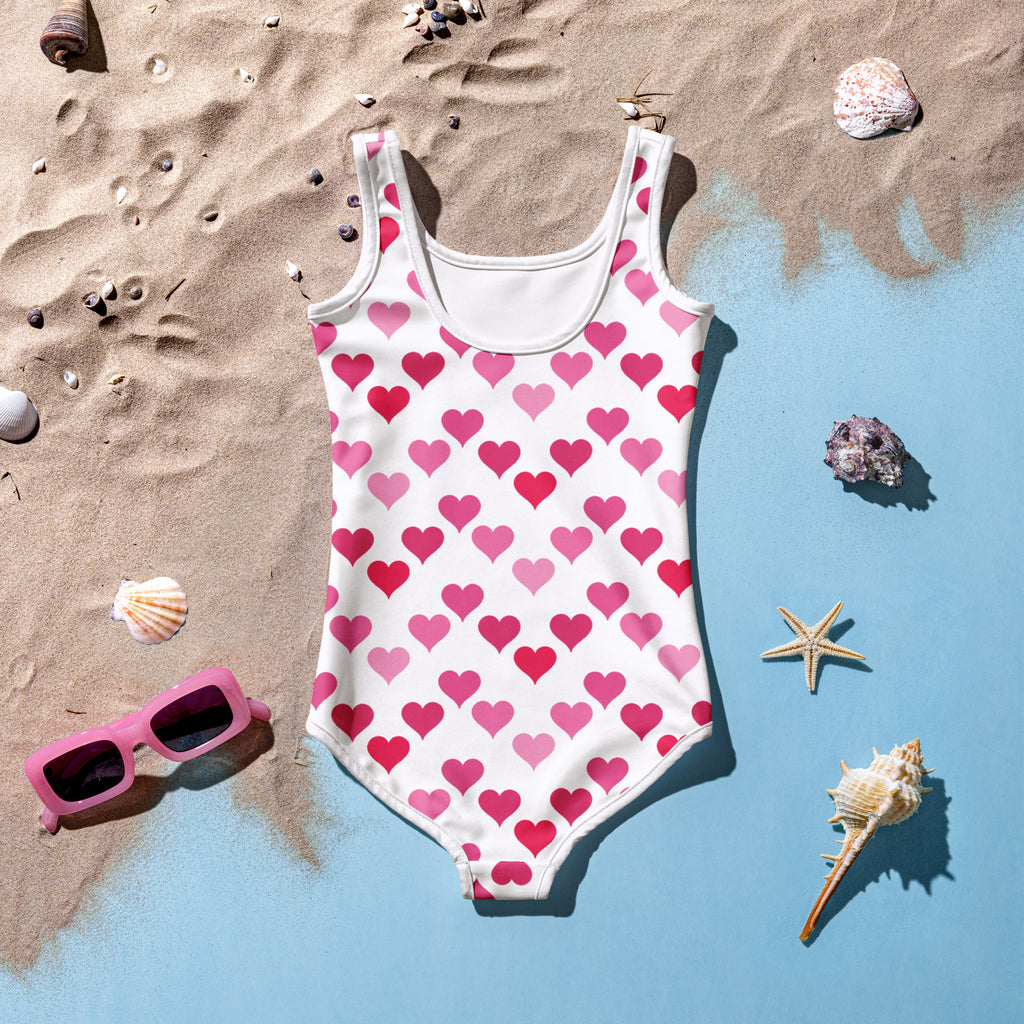 Girls Valentines Day white one piece swimsuit with pink heart pattern buttery soft fabric and UPF 50 plus protection