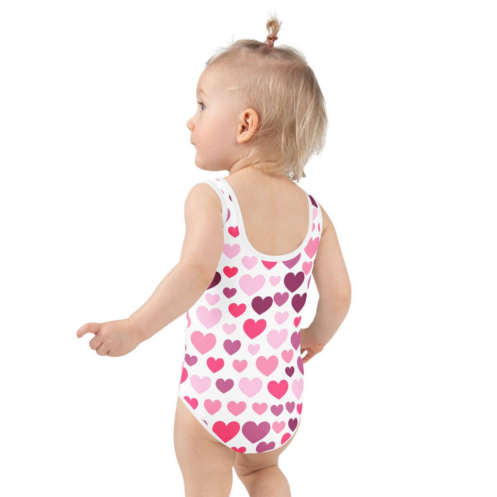 Girl’s white one-piece swimsuit with pink and purple hearts buttery soft fabric upf 50 plus double layered front