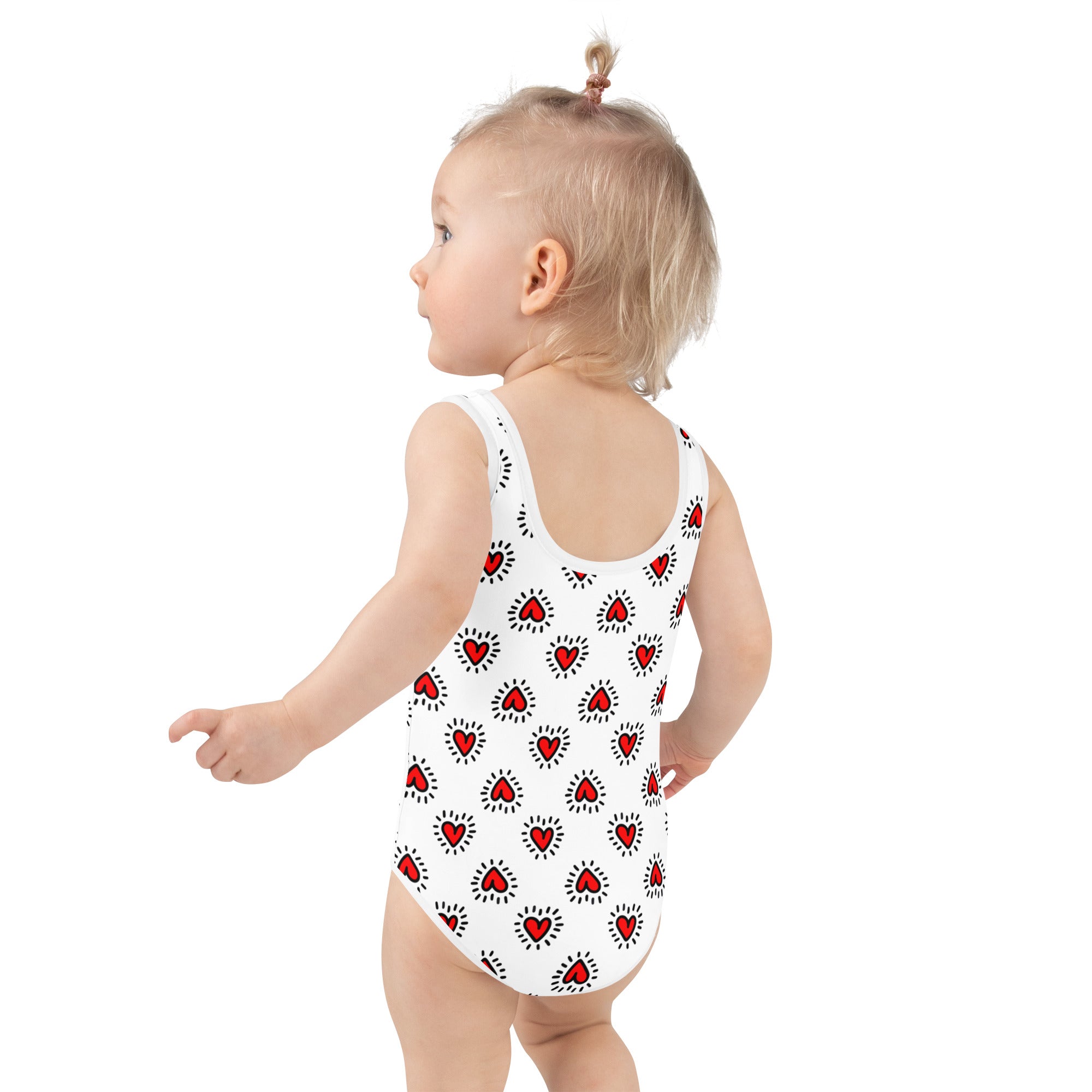 Girls Valentine’s Day doodle heart buttery soft white swimsuit with red hearts outlined in black and radiating dots upf 50+