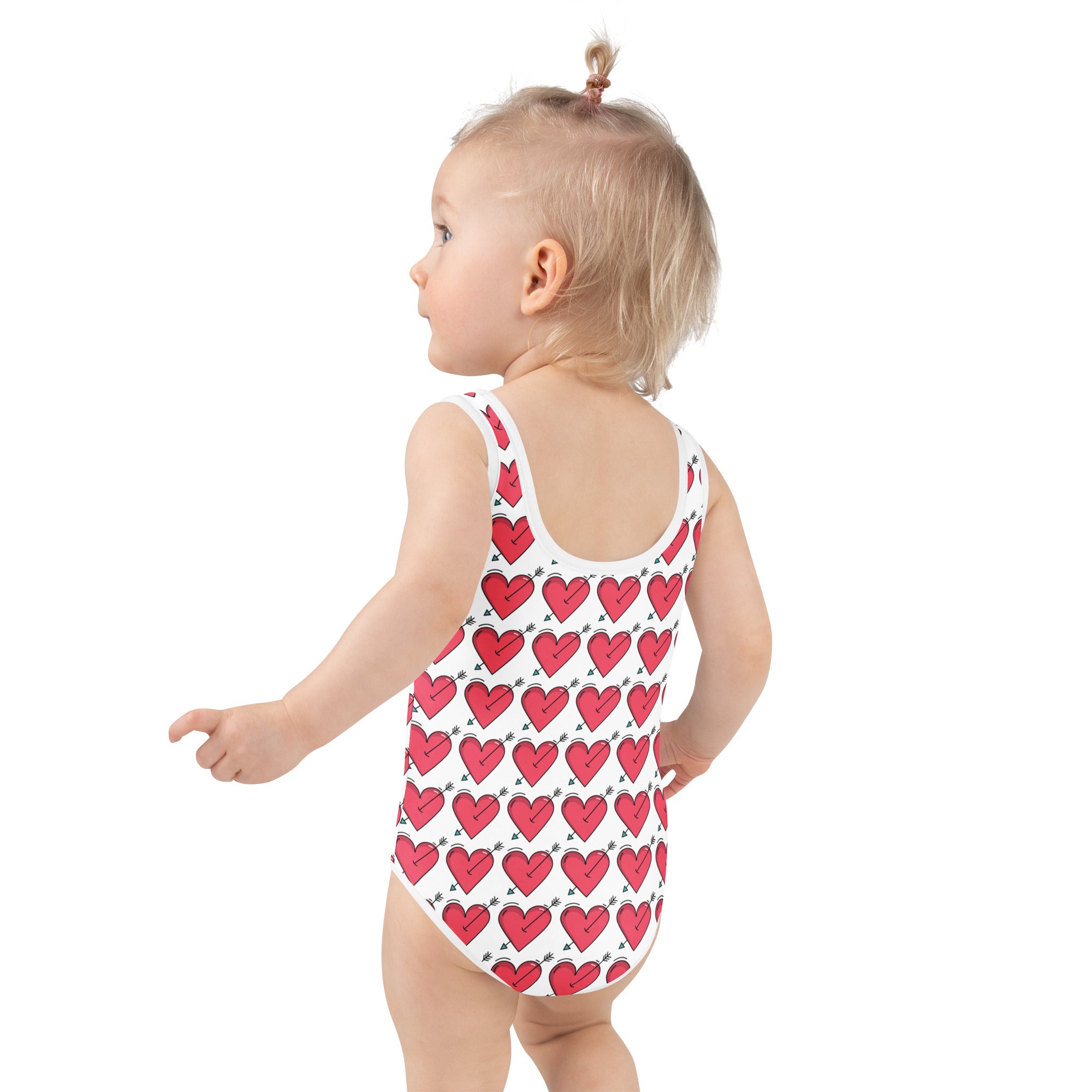 Girls arrow heart buttery soft white one-piece swimsuit with red hearts outlined in black UPF 50 double layered front