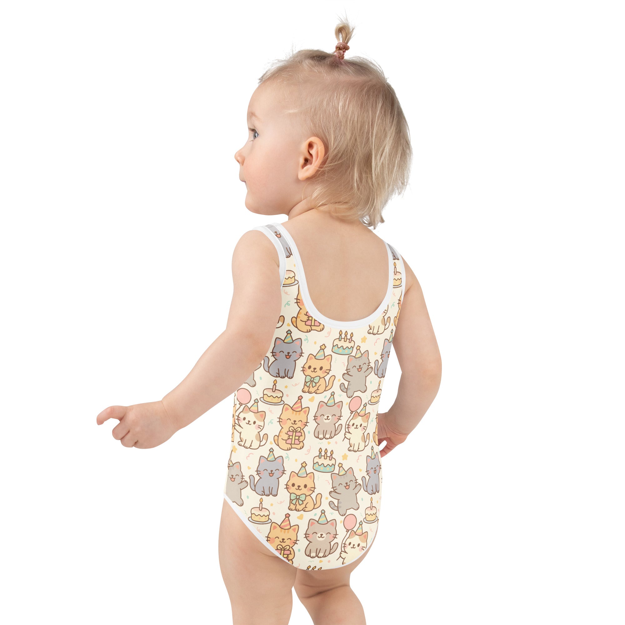 A child wearing a cream girls kitten birthday buttery soft swimsuit with UPF 50+ and double layered front