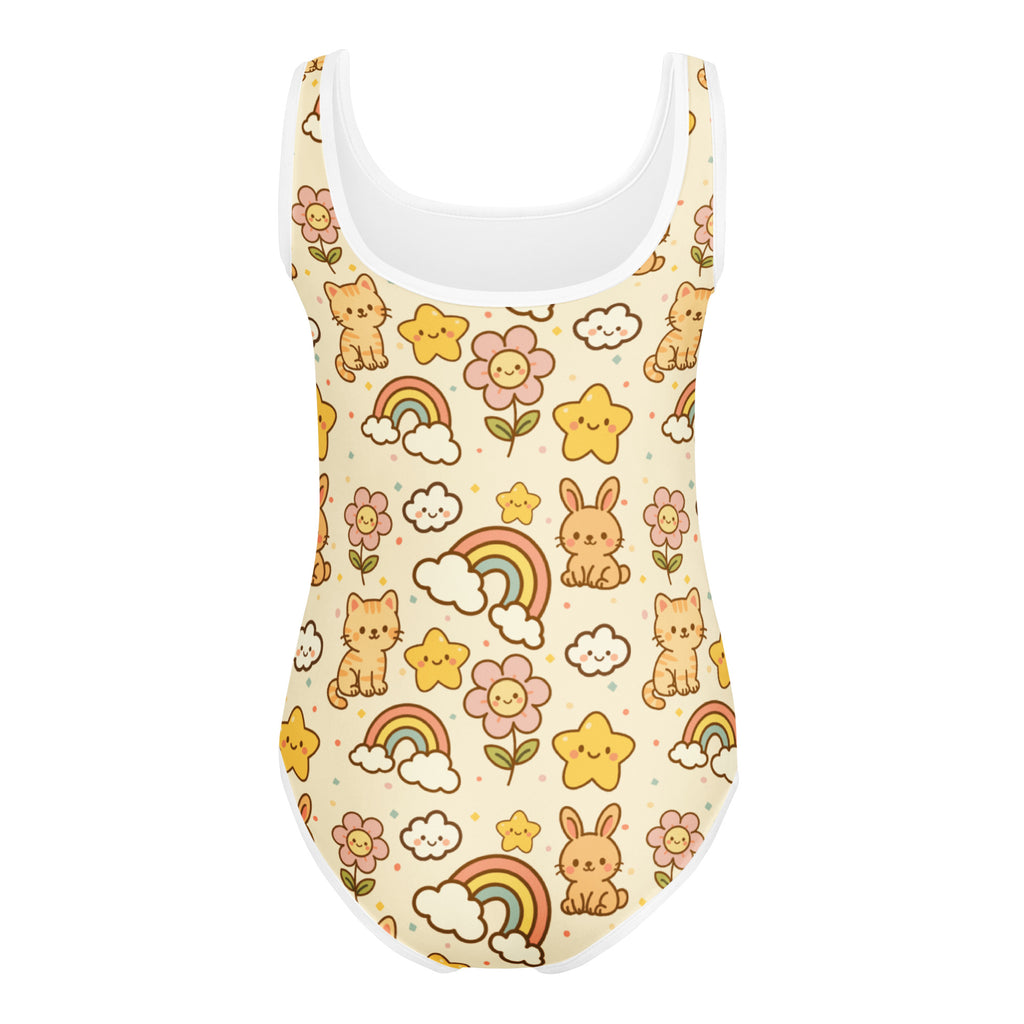 A cream-colored buttery soft girls leotard with cartoon cats rabbits rainbows and flowers for dance and gymnastics