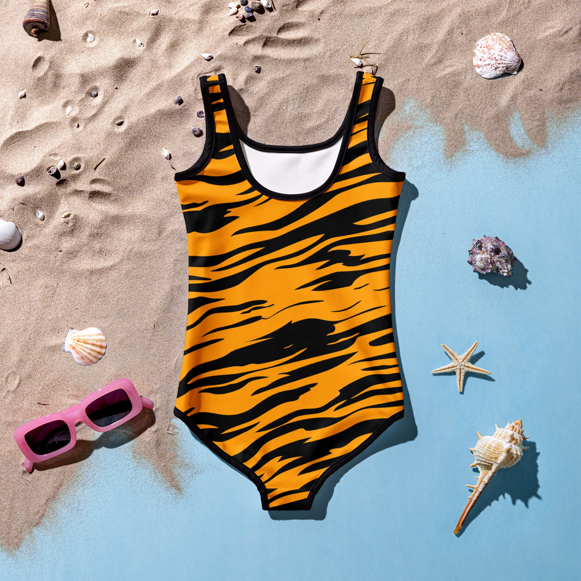 Girls tiger stripe buttery soft one-piece swimsuit in vibrant orange and black with white inner lining and UPF 50+ protection