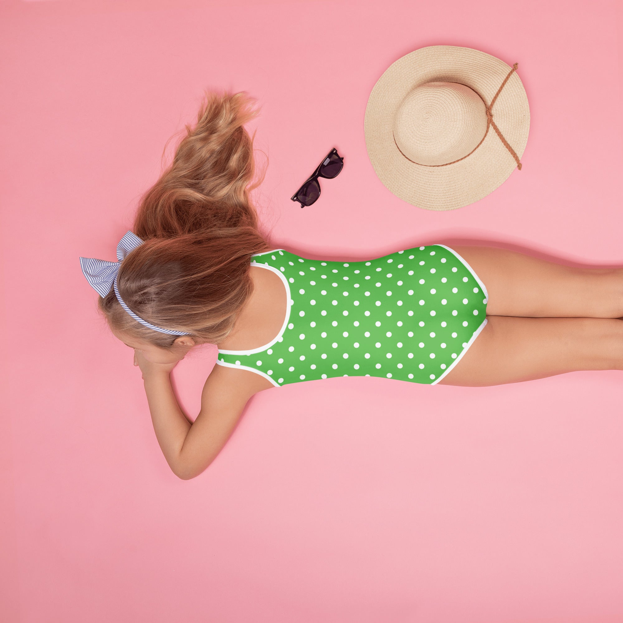 Girls green one-piece swimsuit with white polka dots white trim buttery soft fabric and upf 50 plus protection