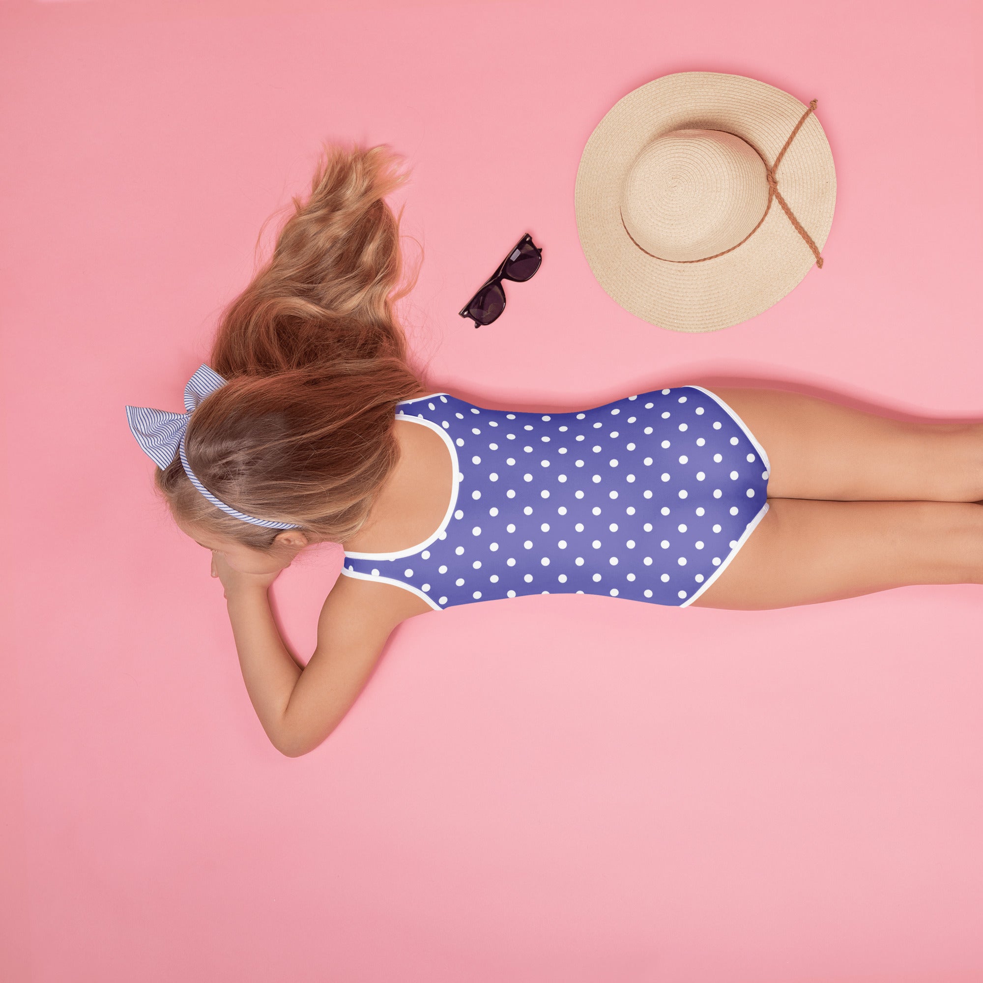 Girls blue one-piece swimsuit with white polka dots and trim buttery soft fabric UPF 50 plus protection