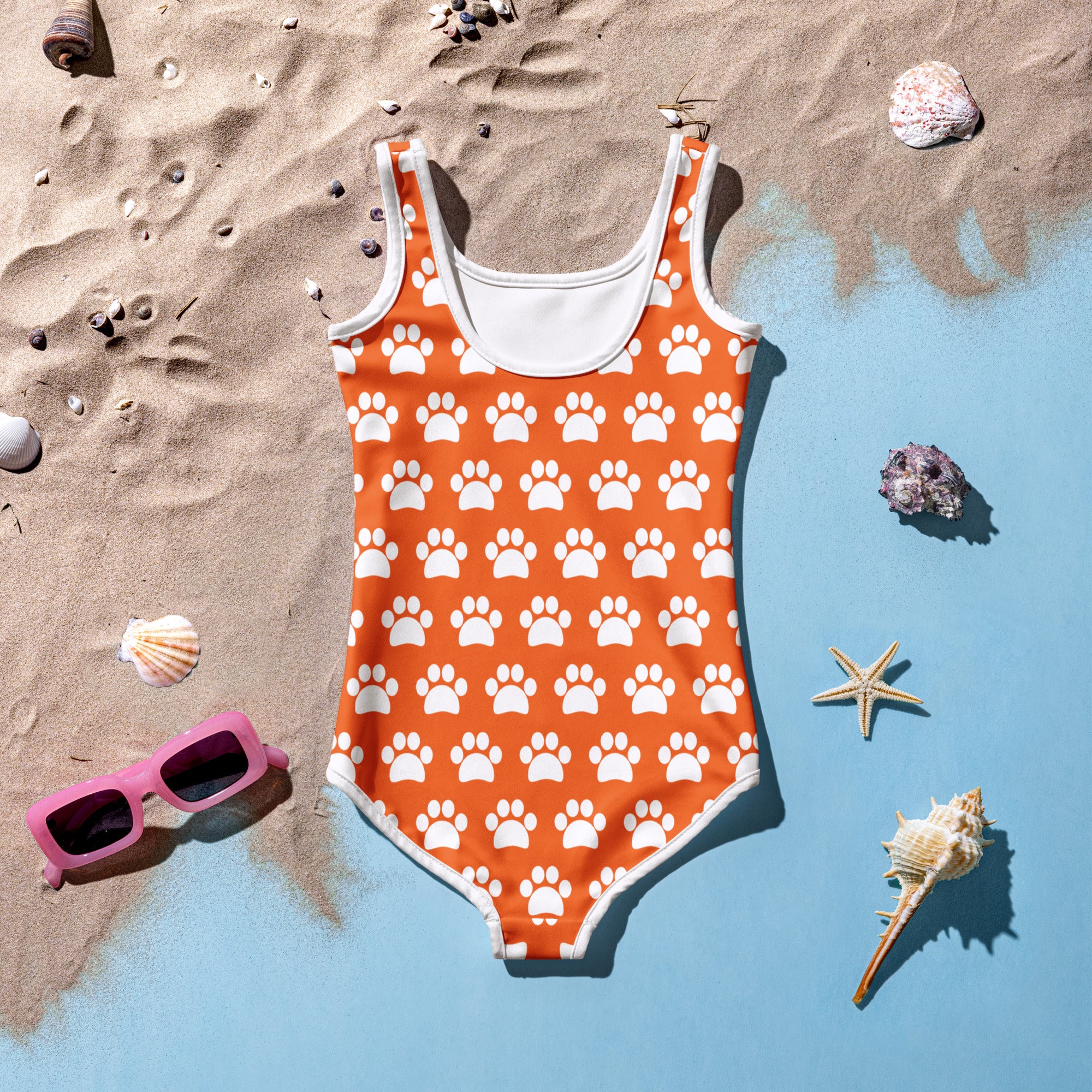 Girls orange one-piece swimsuit with white paw print pattern white trim buttery soft fabric UPF 50 plus protection