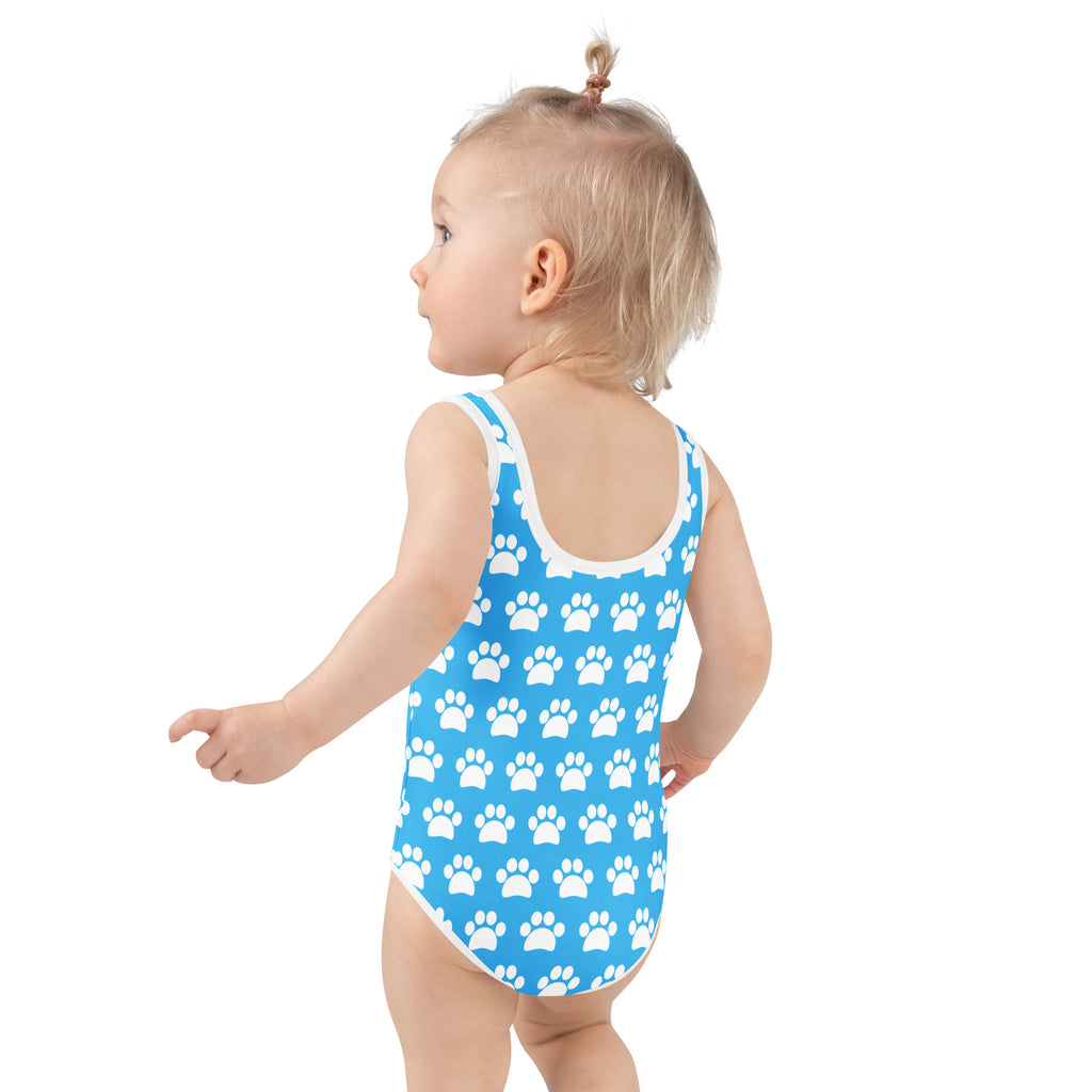 Girls sky blue buttery soft one-piece swimsuit with white paw print pattern white trim and UPF 50 plus sun protection