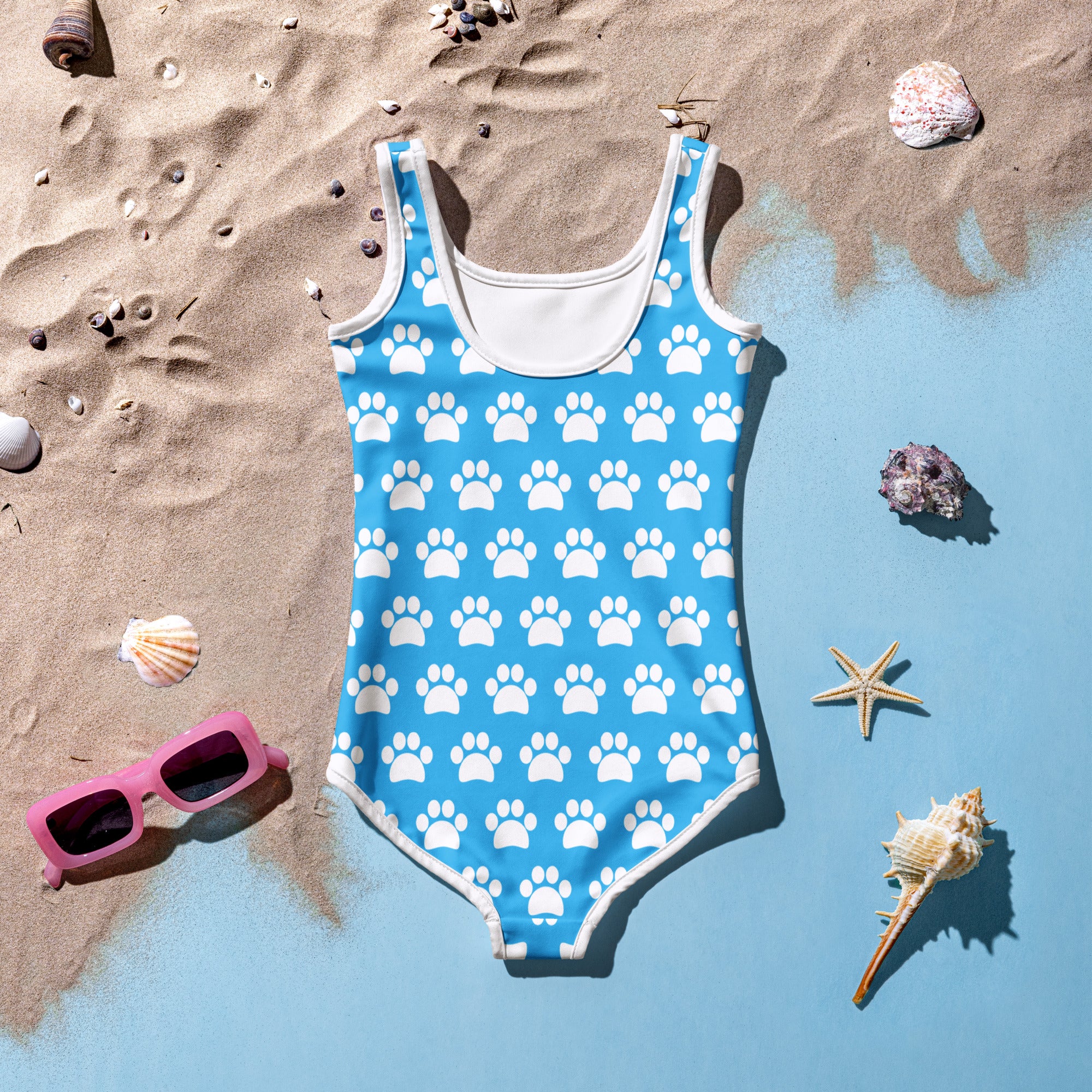 Girls sky blue one-piece swimsuit with white paw print pattern and trim, buttery soft fabric, UPF 50+ protection