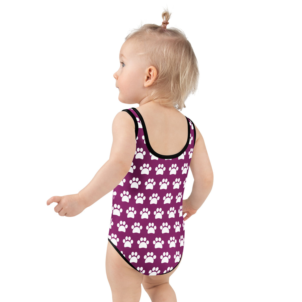 Girls purple paw print buttery soft swimsuit with upf 50 plus and black trim in one piece design